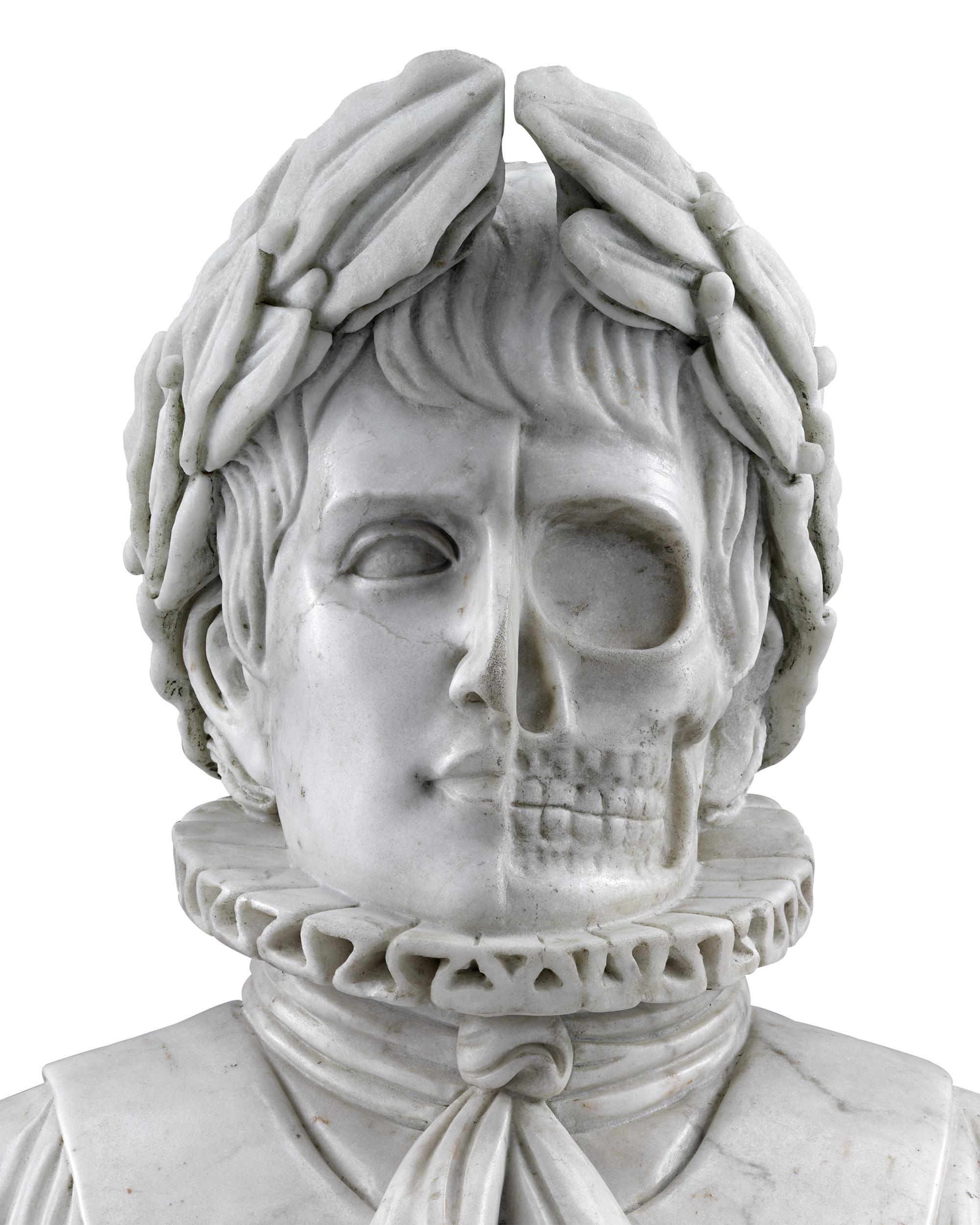 Grand in subject, scale and execution, this remarkable marble bust of Napoleon depicts the military and political leader in both life and death, as half his face is crafted to reveal the structure of his noble skull. While there are many busts of