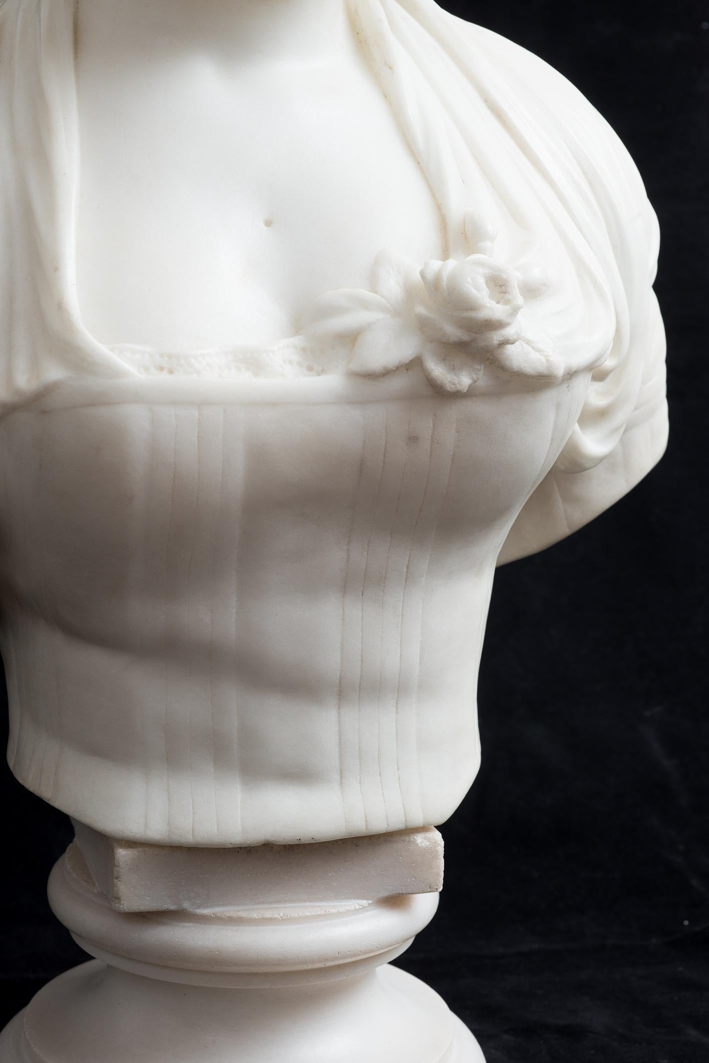 Antique French Napoleon III sculpture in white statuary marble depicting the bust of a noblewoman.

The woman is depicted in the clothing of the period and is of great value and great quality.

Magnificent patina and veining of the marble expresses
