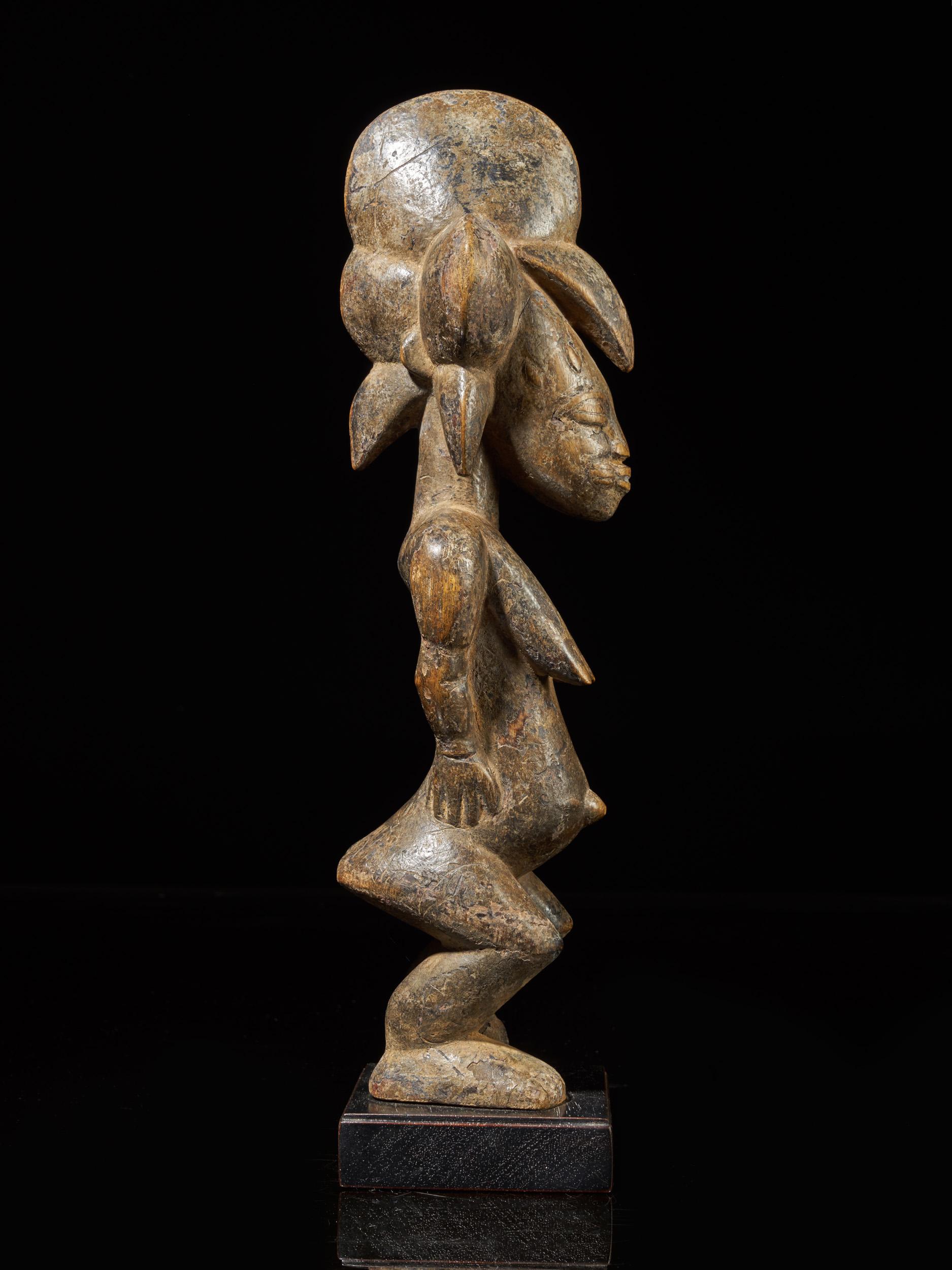Senufo People, Ivory Coast, Standing Female Tugubele Divination Figure. - Brown Figurative Sculpture by Unknown