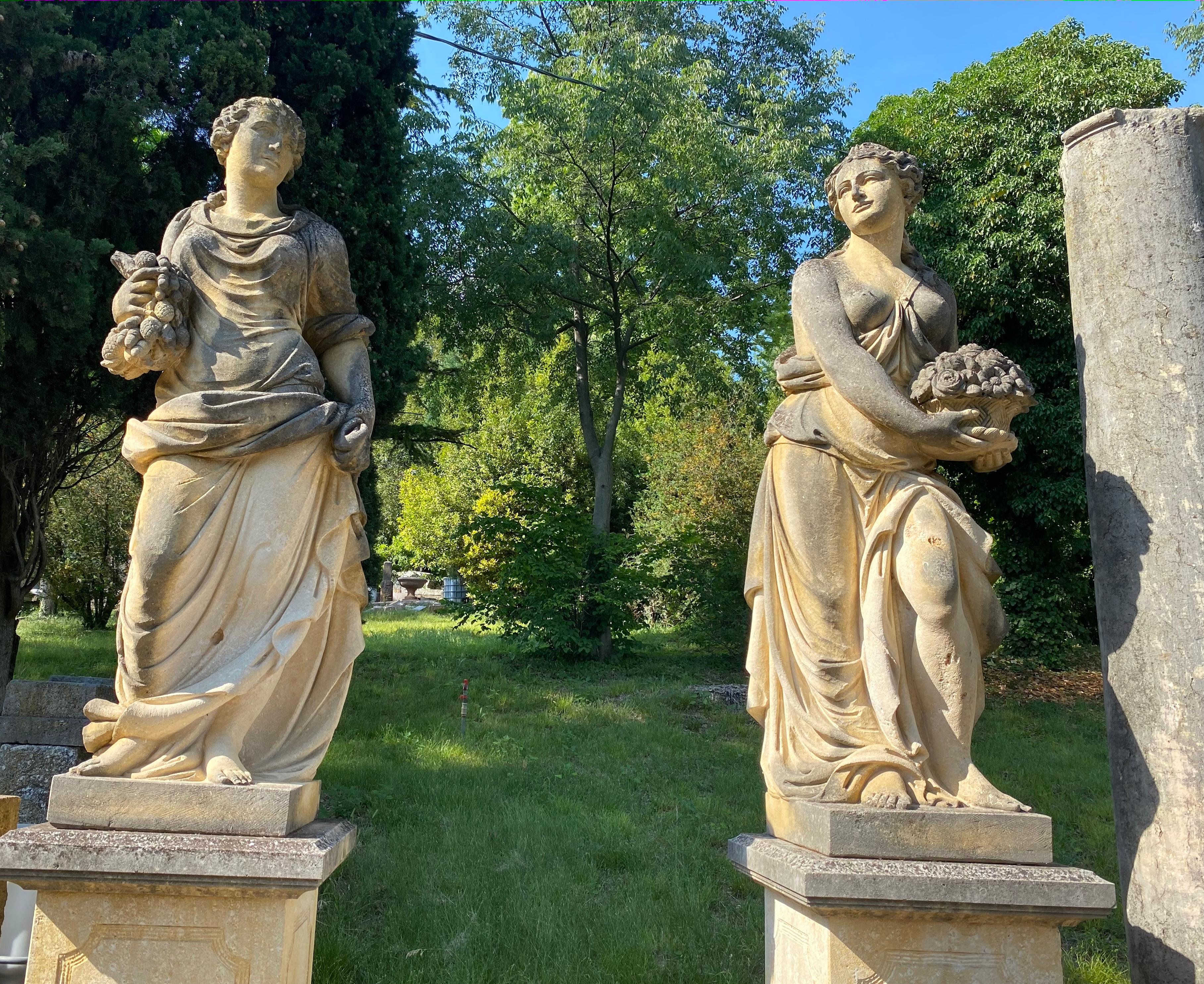 Monumental classically draped female figures and their distinguishing symbols on a square base. 
Autumn, winter, spring and summer. Measures: Height of the sculptures cm 190 with square form bases cm H 110  x W 69x 64.
 
