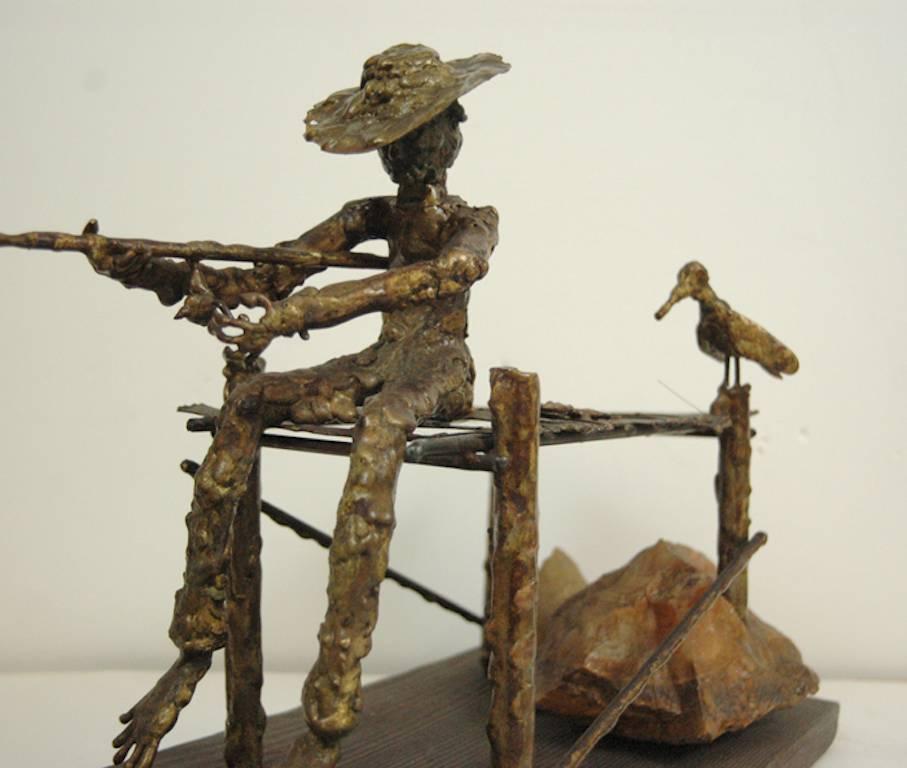 signed illegibly; Fisherman and Bird; bronze, wood, rock - Brown Figurative Sculpture by Unknown