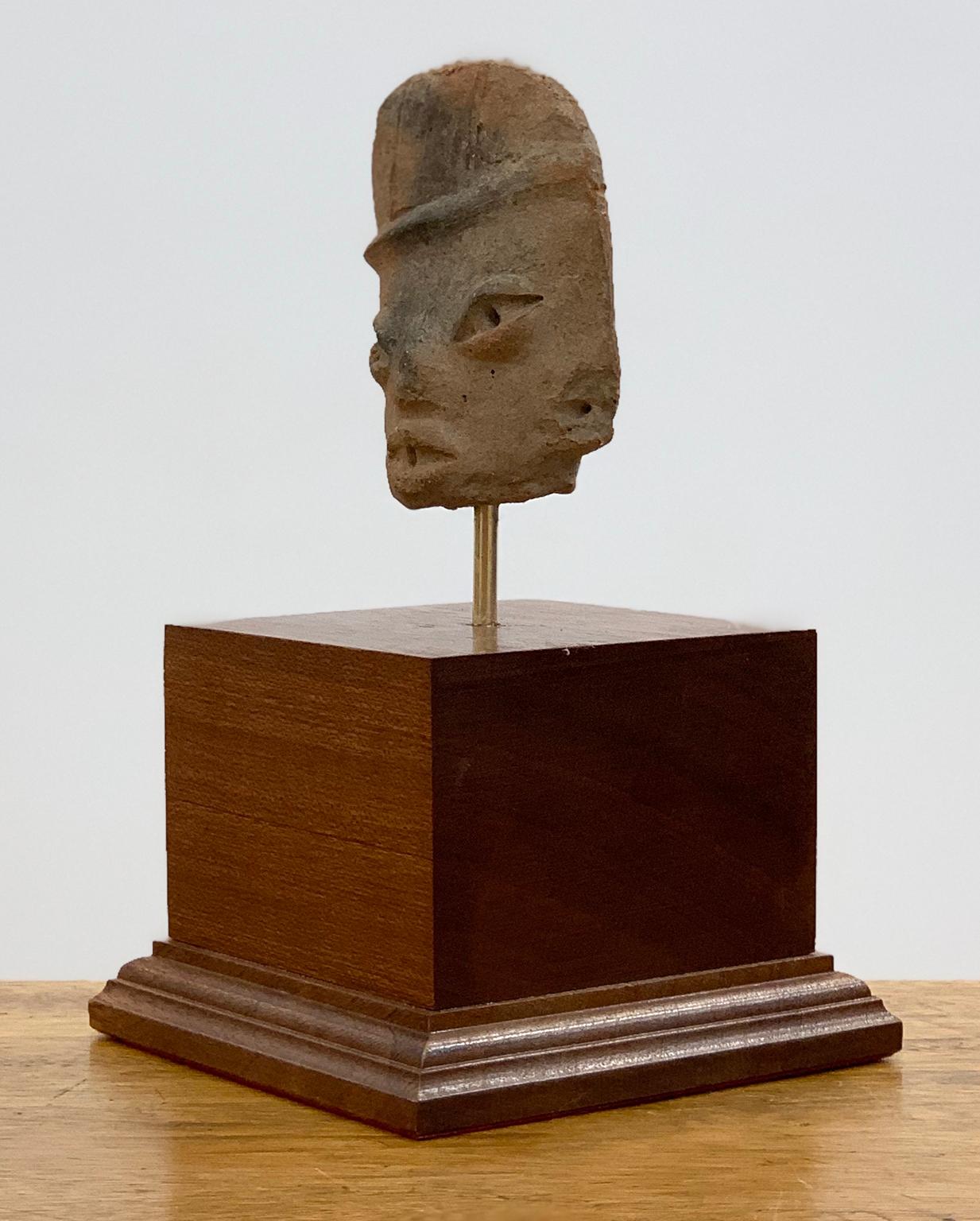 Small head of a flat figure with headdress - Michoacán - West Mexico. - Sculpture by Unknown