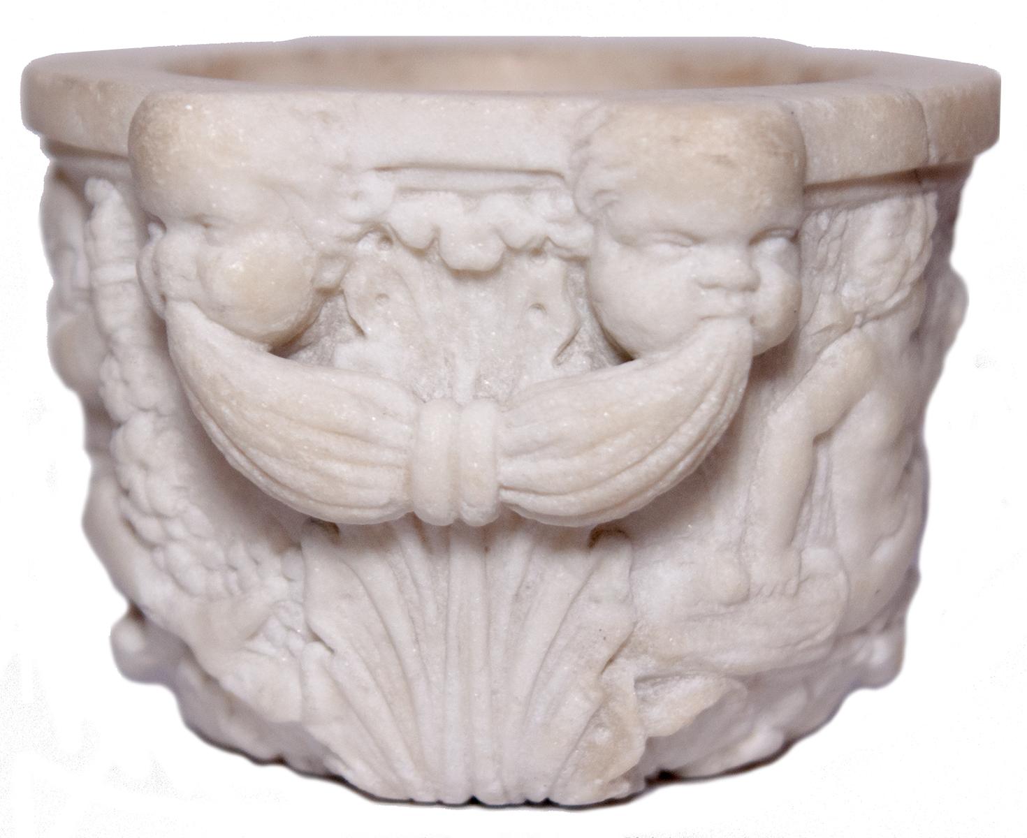 Small mortar or marble measure adorned with acanthus leaves and scenes of putti and fauns playing and drinking. The handles consist of putti masks disguising foliage.

Diameter: 9.5 to 10.5 - Height: 7 cm

Italy or Germany, end 18 th - early 19 th