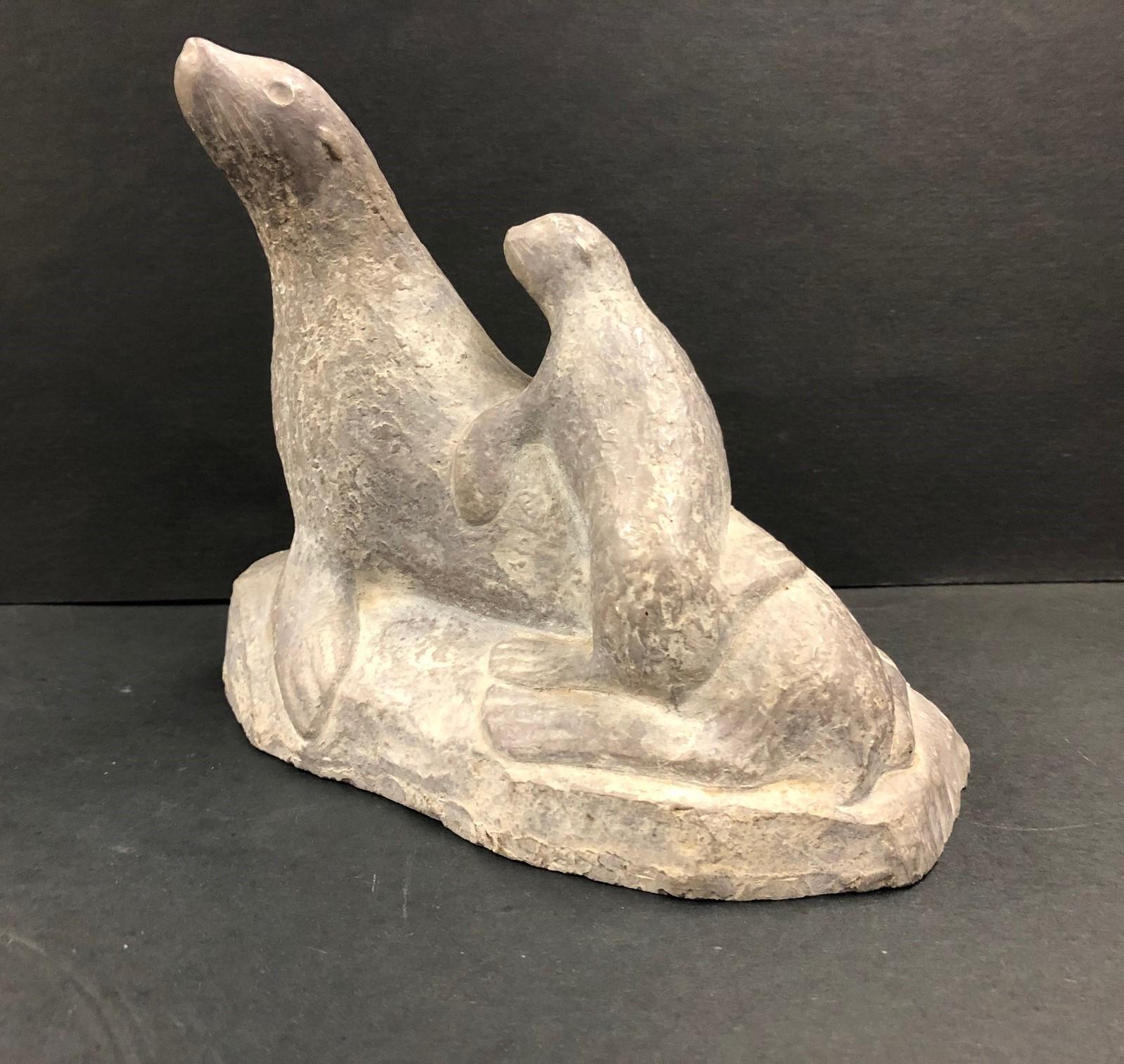 Stone Carving of a Mother and Baby Seal-Abbott Canada - Sculpture by Unknown