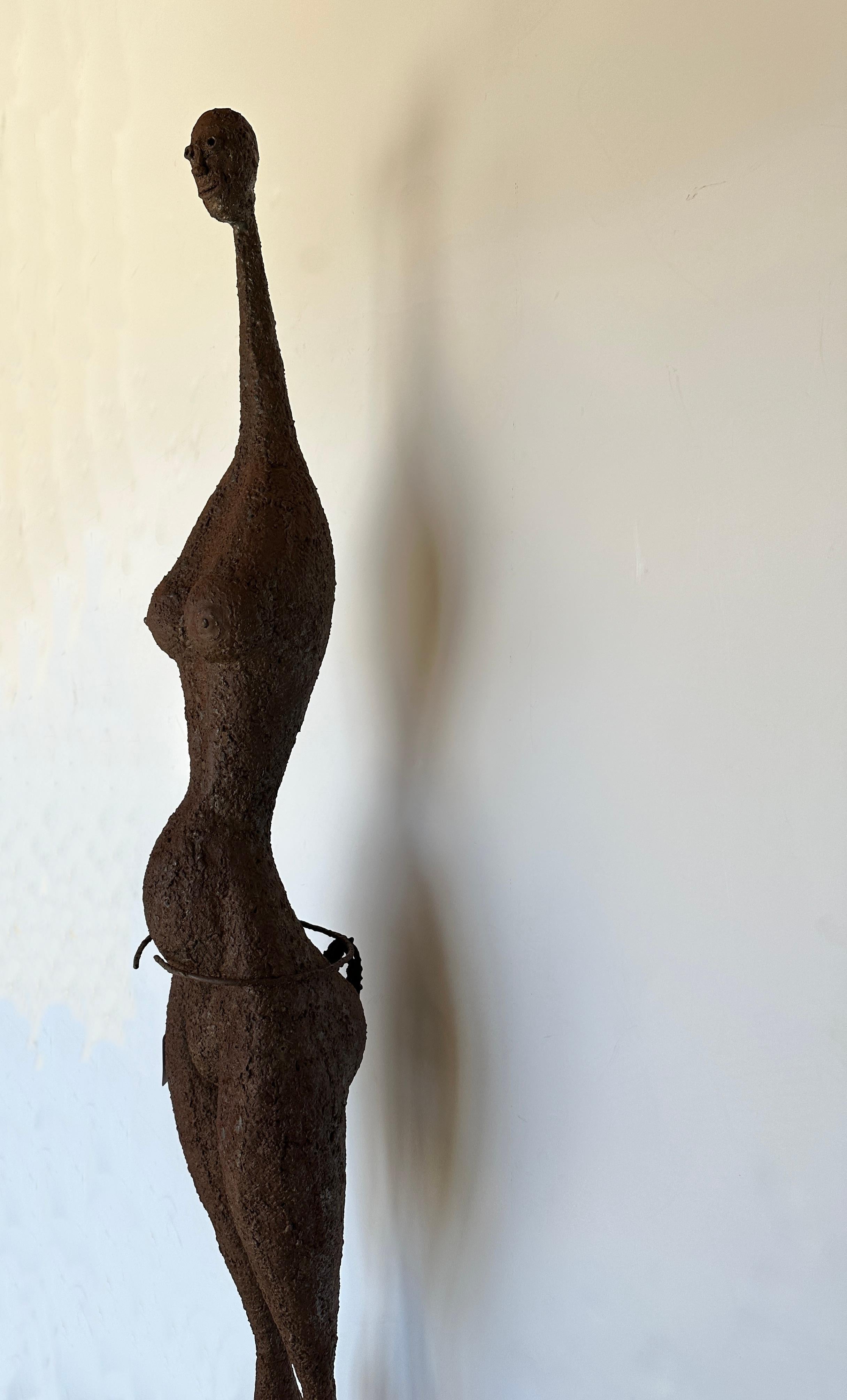 Modern Tall Life Size Alien Iron Statue on a Round Concrete Base - Black Nude Sculpture by Unknown