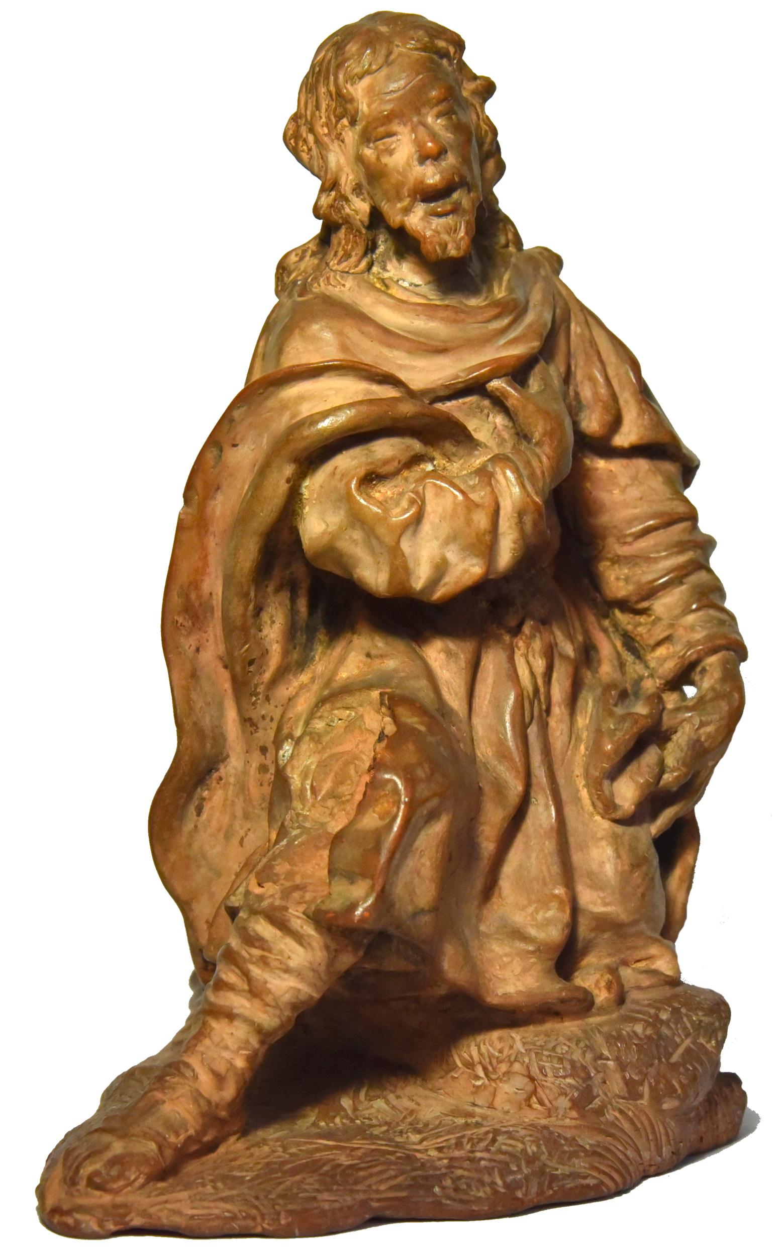 Terracotta figure of a shepherd, Italian school of the 18th century

This figure of a kneeling old man, dressed in rustic clothes, who places his hand on his heart, certainly represents a shepherd.
It may be a terracotta figure for a nativity