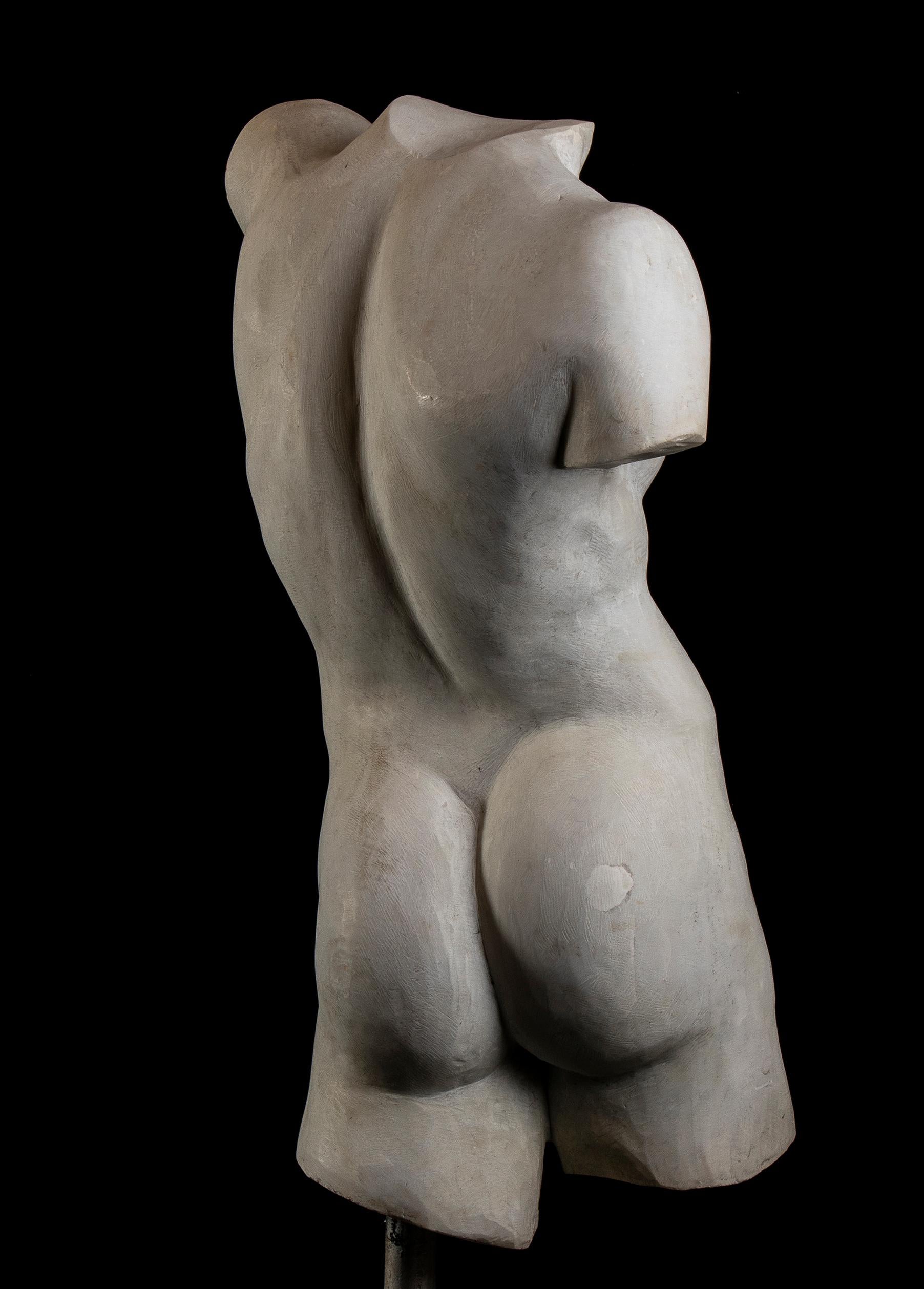 A Roman Marble Torso of a Youth or Athlete of the first half or beginning of the  20th Century standing with the weight on his left leg,  resting on a stainless steel square base, made in according with the aesthetic and artistic canons of the