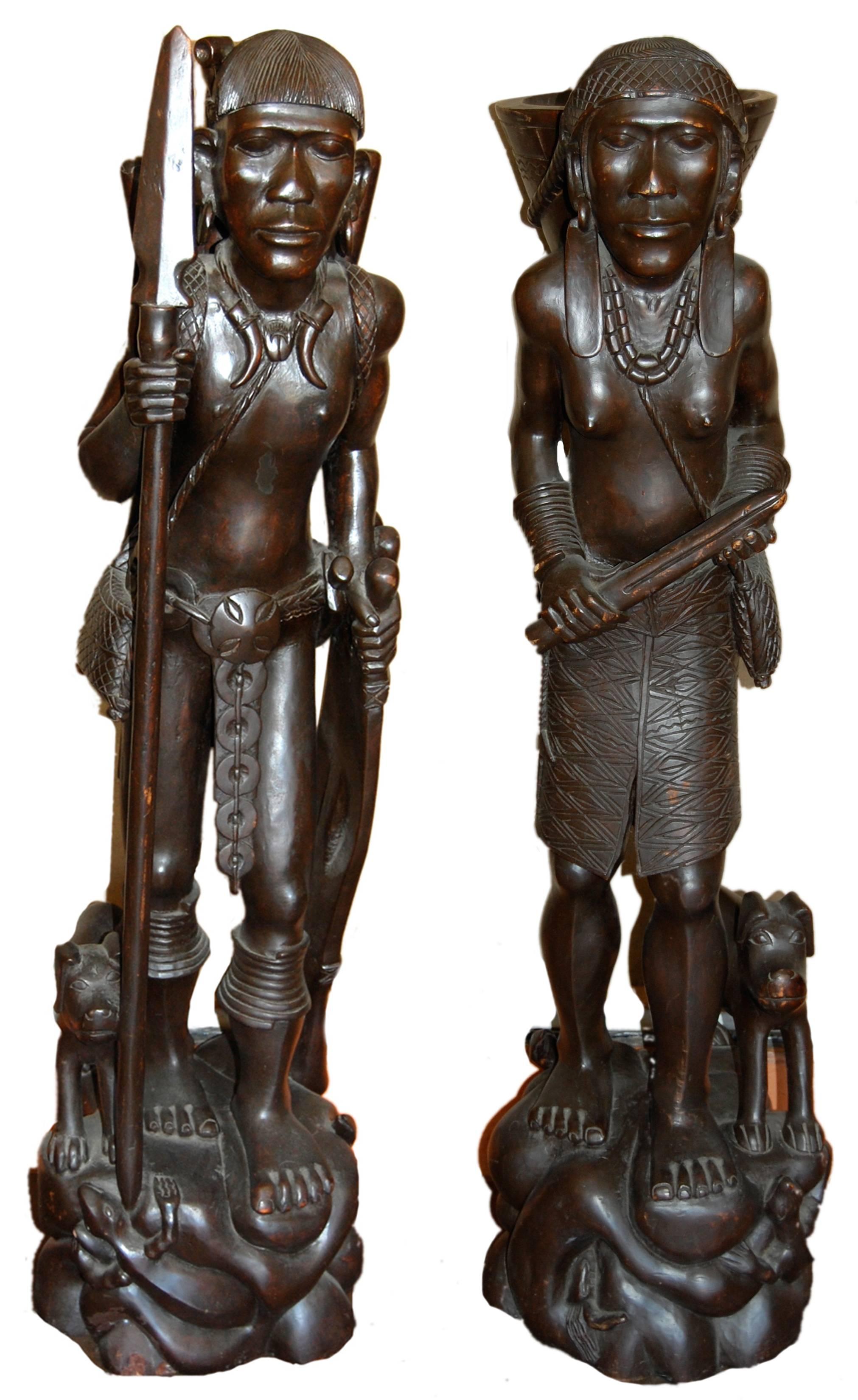 Unknown Figurative Sculpture - Two African sculptures of man; carved wood with Emu egg