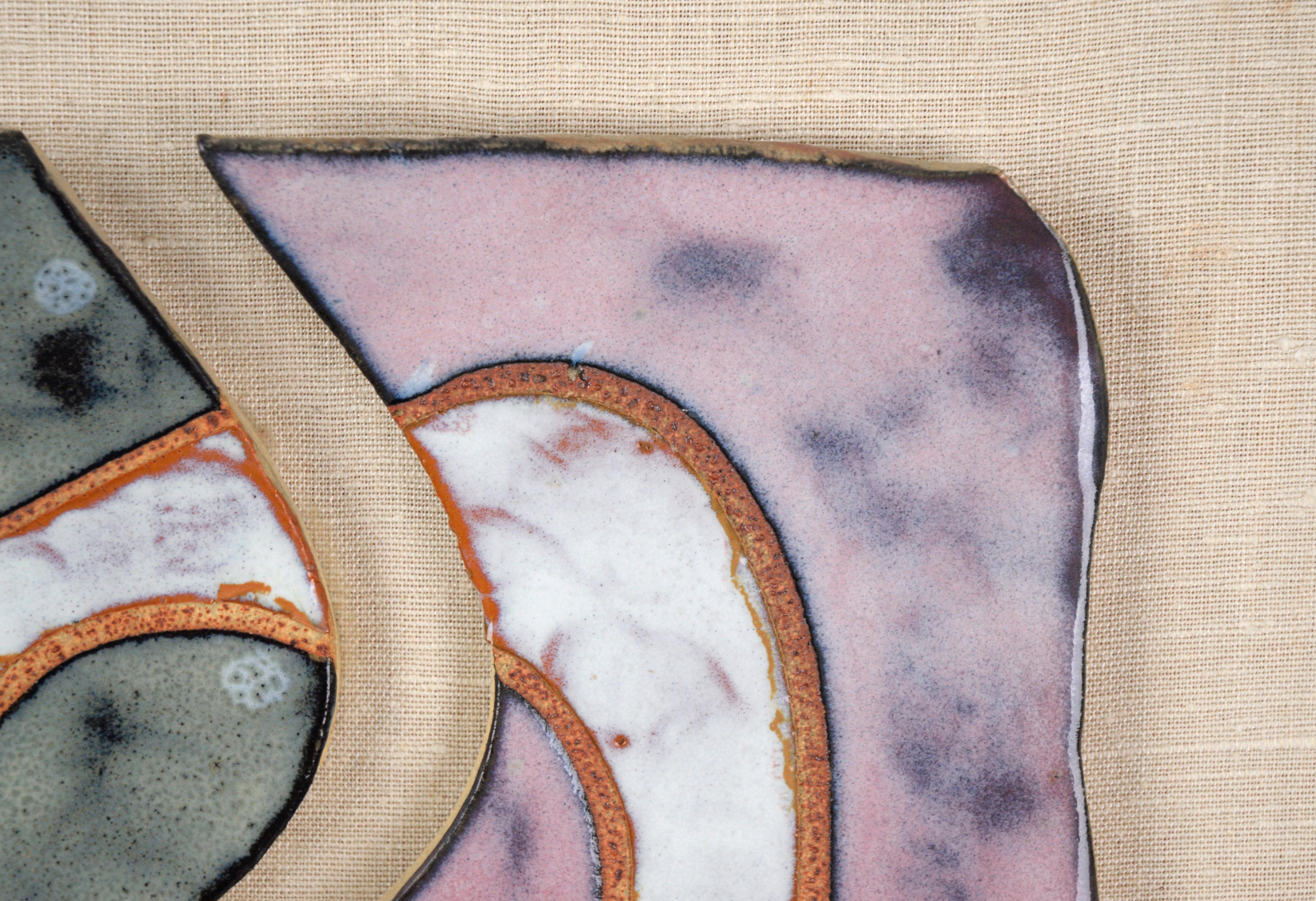 Balanced sculptural composition by an unknown artist. Two pieces of a clay sculpture have been glazed in green and pink, with a white shape stretching across them. The pieces are mounted on a wood panel that has been wrapped in linen.

Panel size: