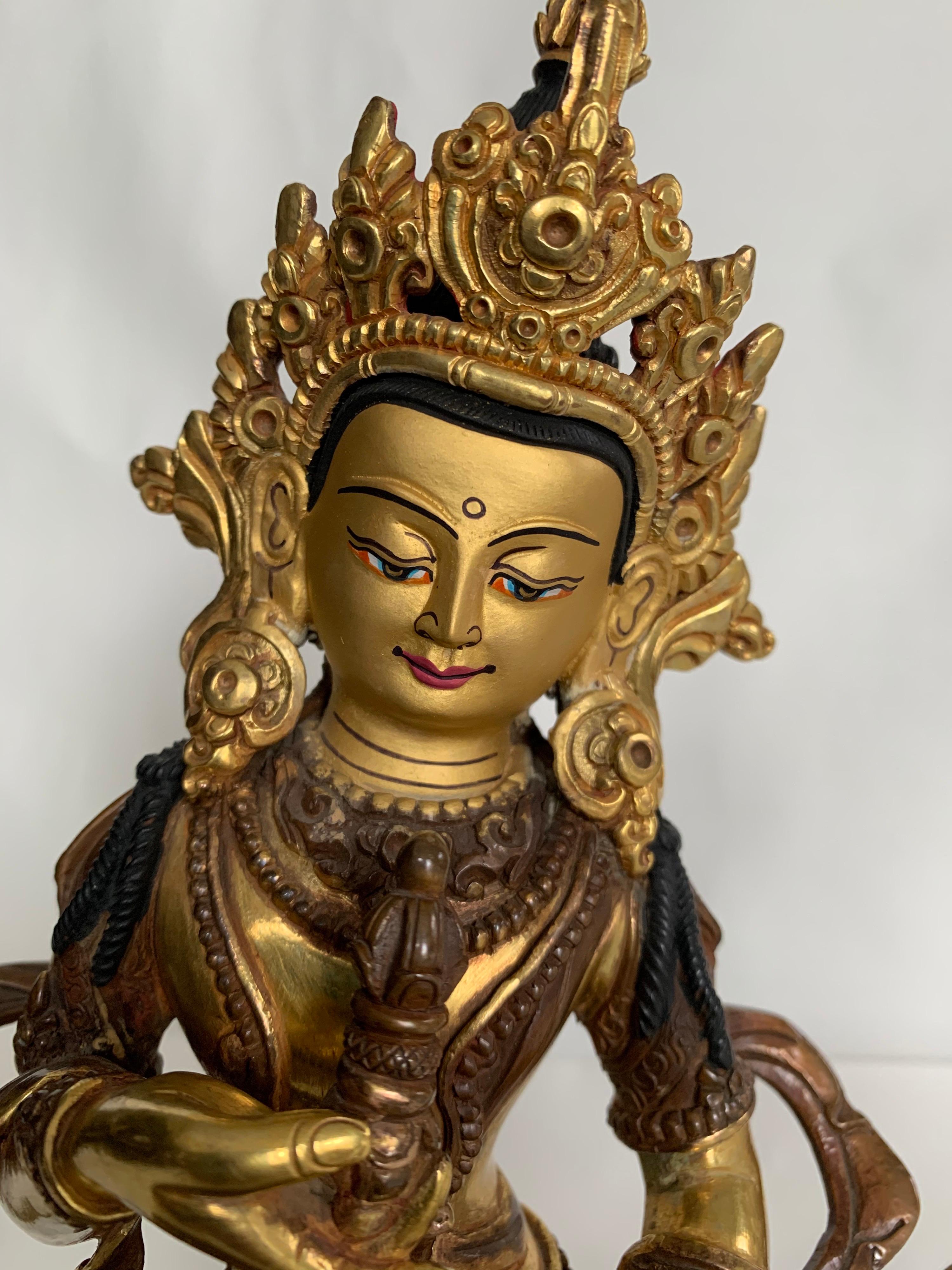 This statue is handcrafted by lost wax process which is one of the ancient process of metal craft. Vajrasattva is seated on lotus with one hand holding a Vajra which is a symbol of protection. 24K real gold plating is done on copper body and comes