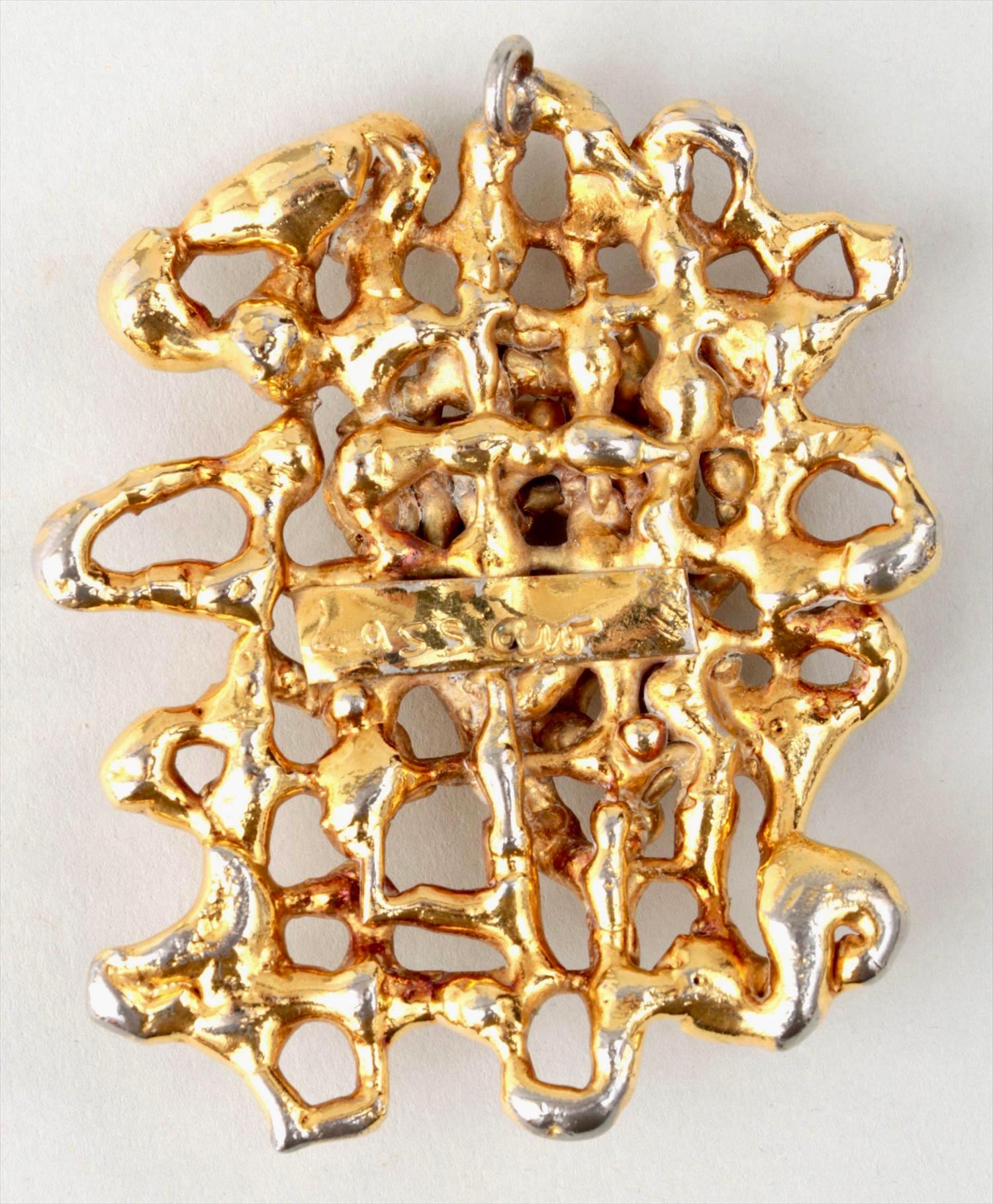 IBRAM LASSAW 
(Russian-American, 1913-2003), 
Sculptural pendant
Gold plated bronze
Signed verso
Measurements: 2-7/8''h, 2-1/4''w.

Ibram Lassaw was born in Alexandria, Egypt, of Russian Jewish émigré parents. After briefly living in Marseille,