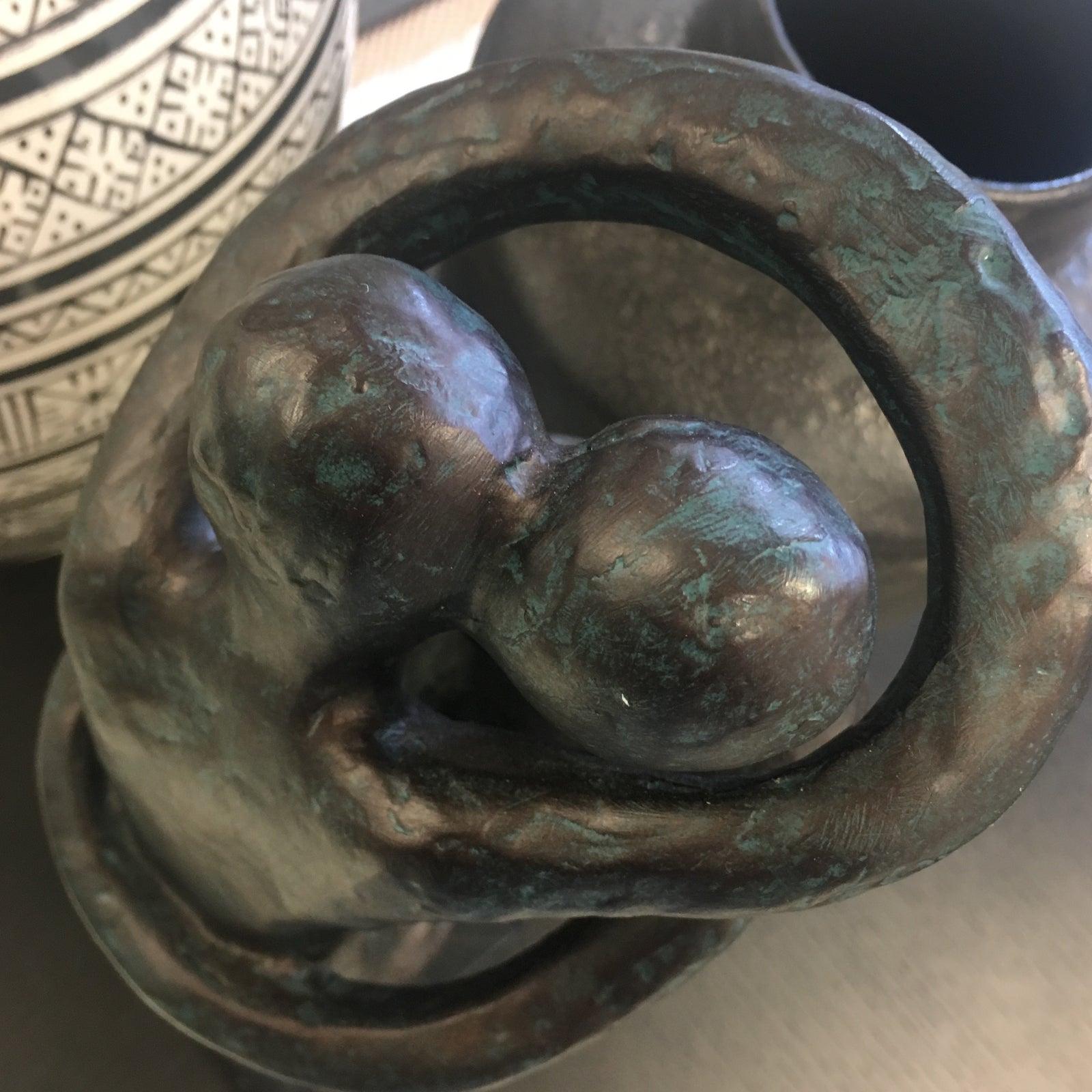 Vintage Sculpture of hugging couple. On black and white marble stand.  Great for bookcases , entry tables , or any other table top surface. Great as a gift