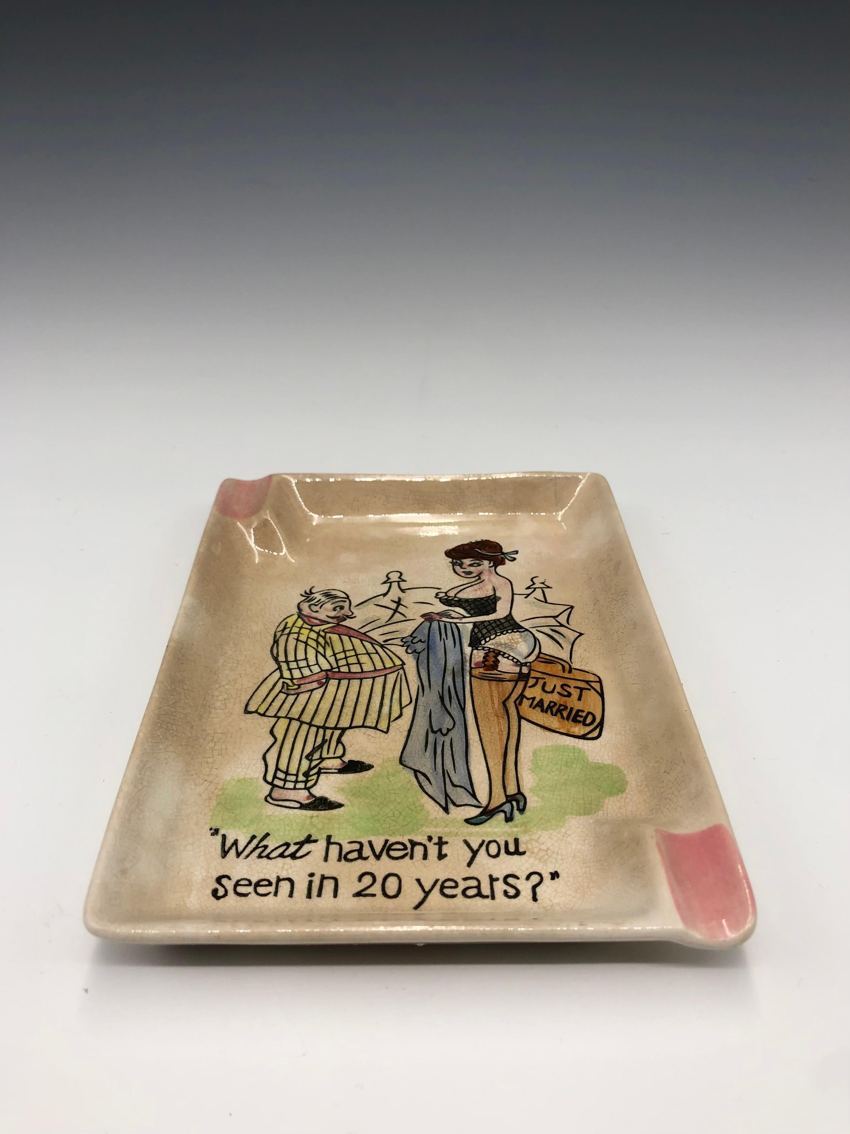 A charming, kitsch comical post-war porcelain ashtray or catchall, vide-poche. Made in Japan during the late 1940s or early 1950s. The original 