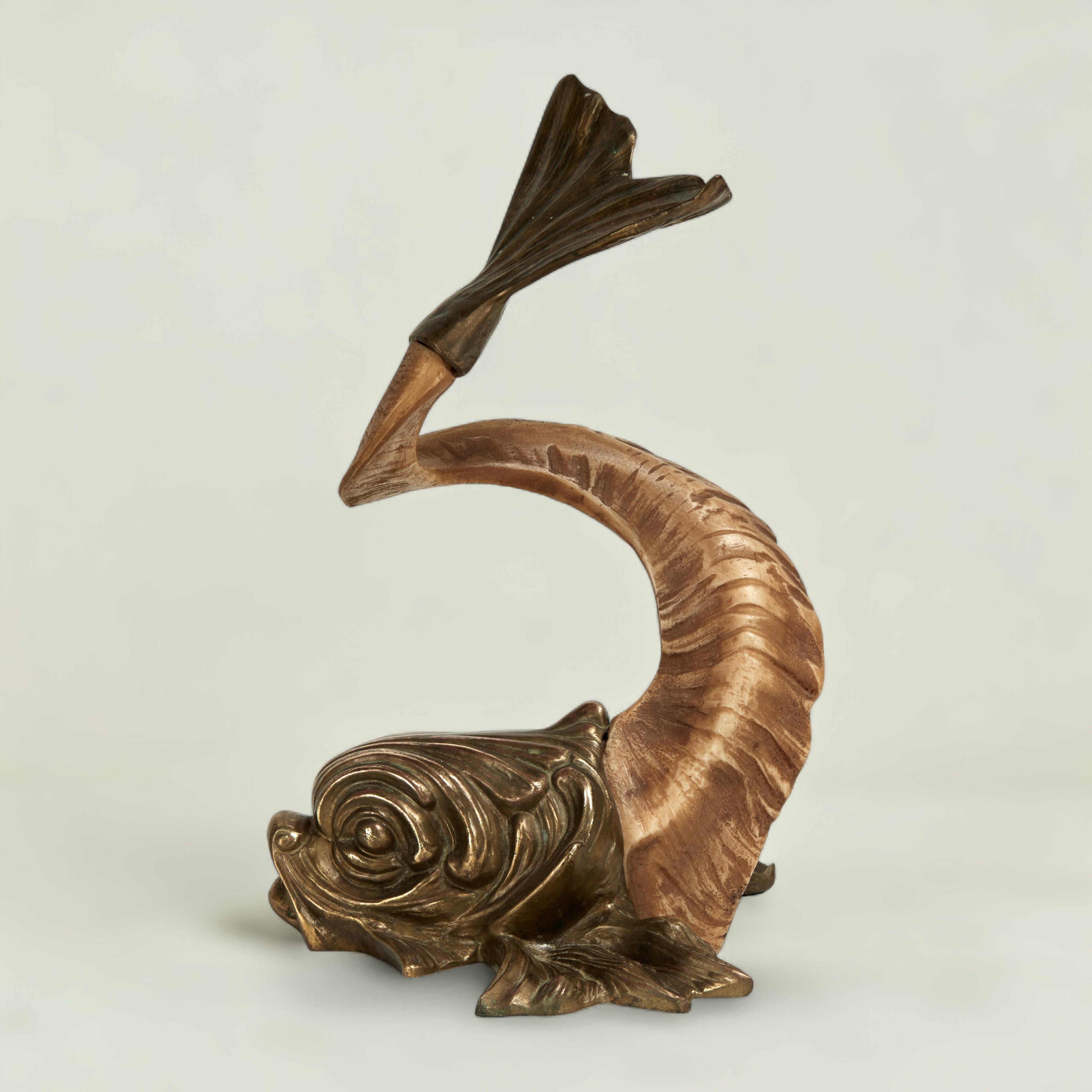 Mid century Italian object of art ingeniously crafted with a ram's horn and cast brass head and tail depicting a neo classical mythological dolphin.
