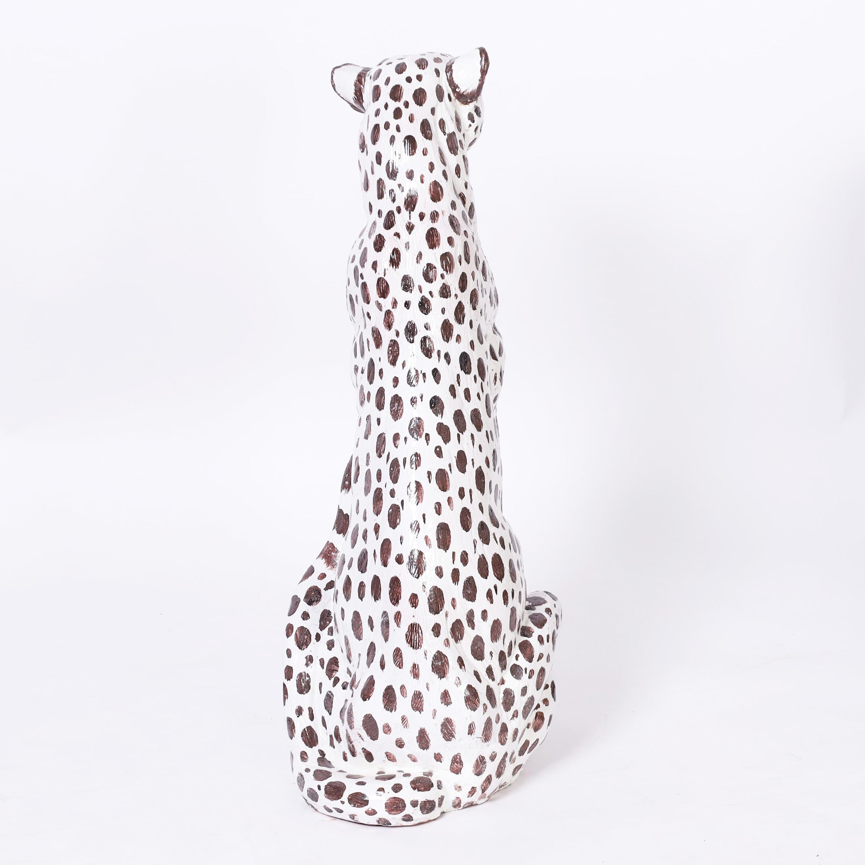 Near life size mid century white cheetah sculpture or figure crafted in terra cotta, hand decorated and glazed. 