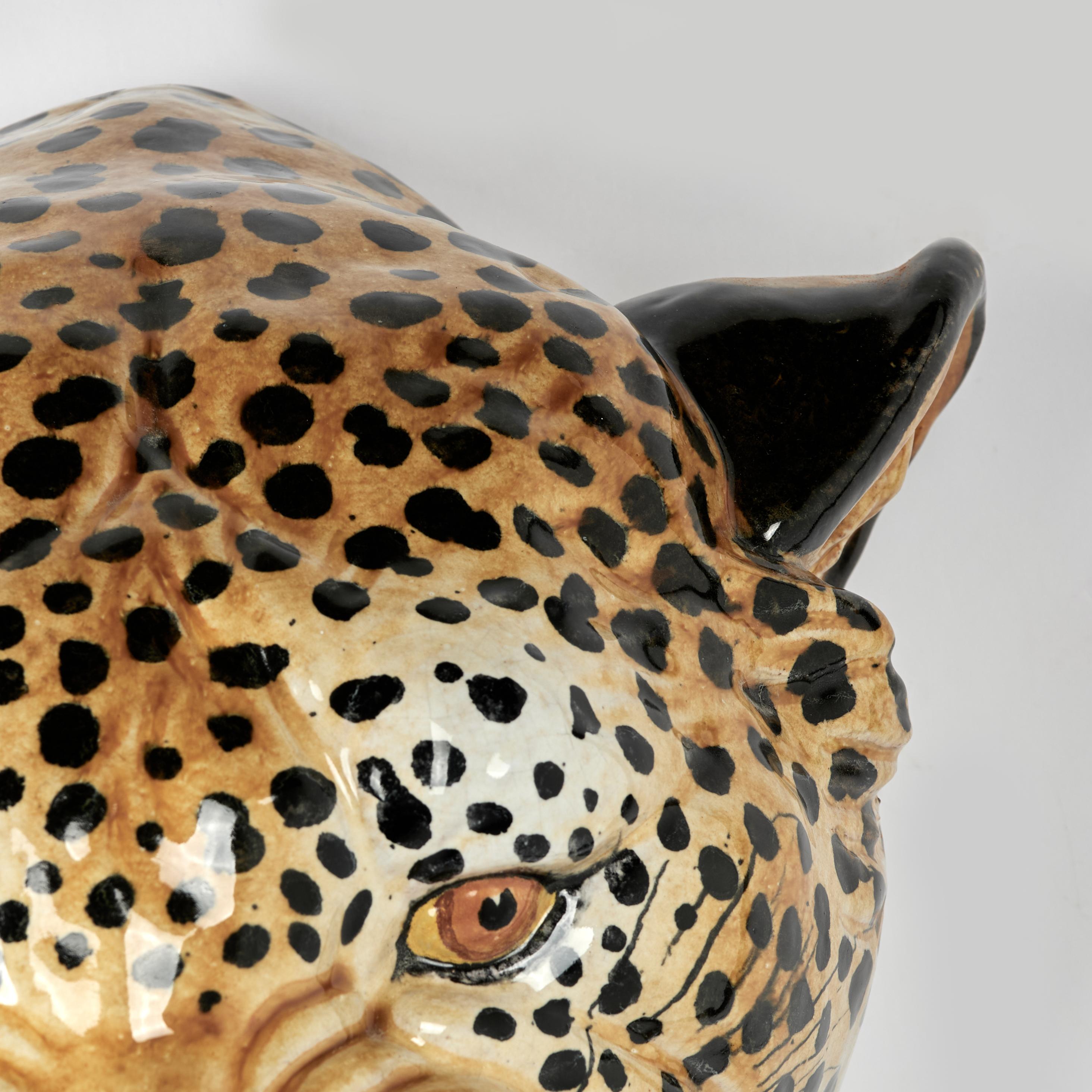 Striking mid century Italian life size leopard head crafted in terra cotta, hand decorated and glazed, now and forever caught in mid growl.