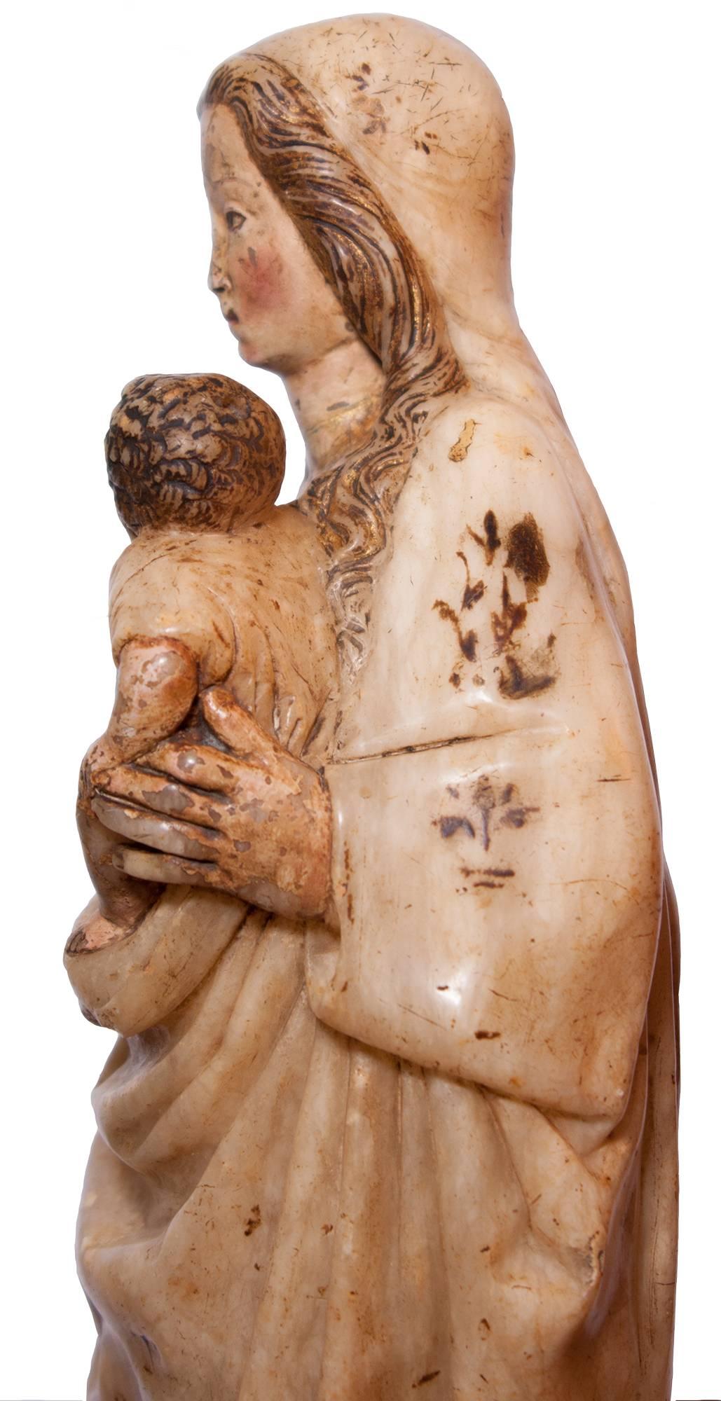 Virgin and Child in alabaster around 1500, Spain - Renaissance Sculpture by Unknown