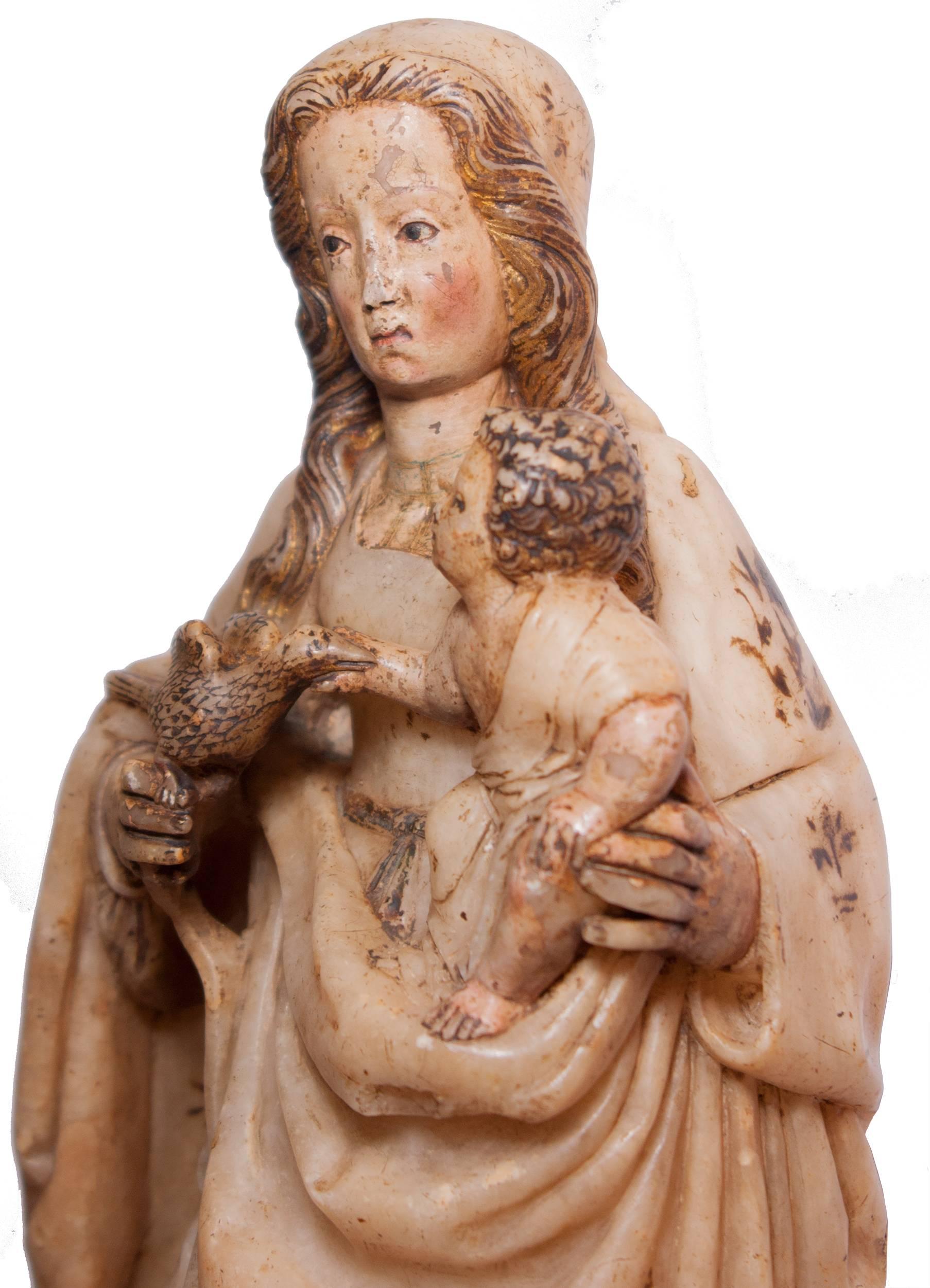 Virgin and Child, in alabaster embellished with gold and pigments, circa 1500, Burgos or Aragonese school.

This beautiful Madonna with Child illustrates the passage of the Spanish sculpture from Gothic to Renaissance, under the double influence of