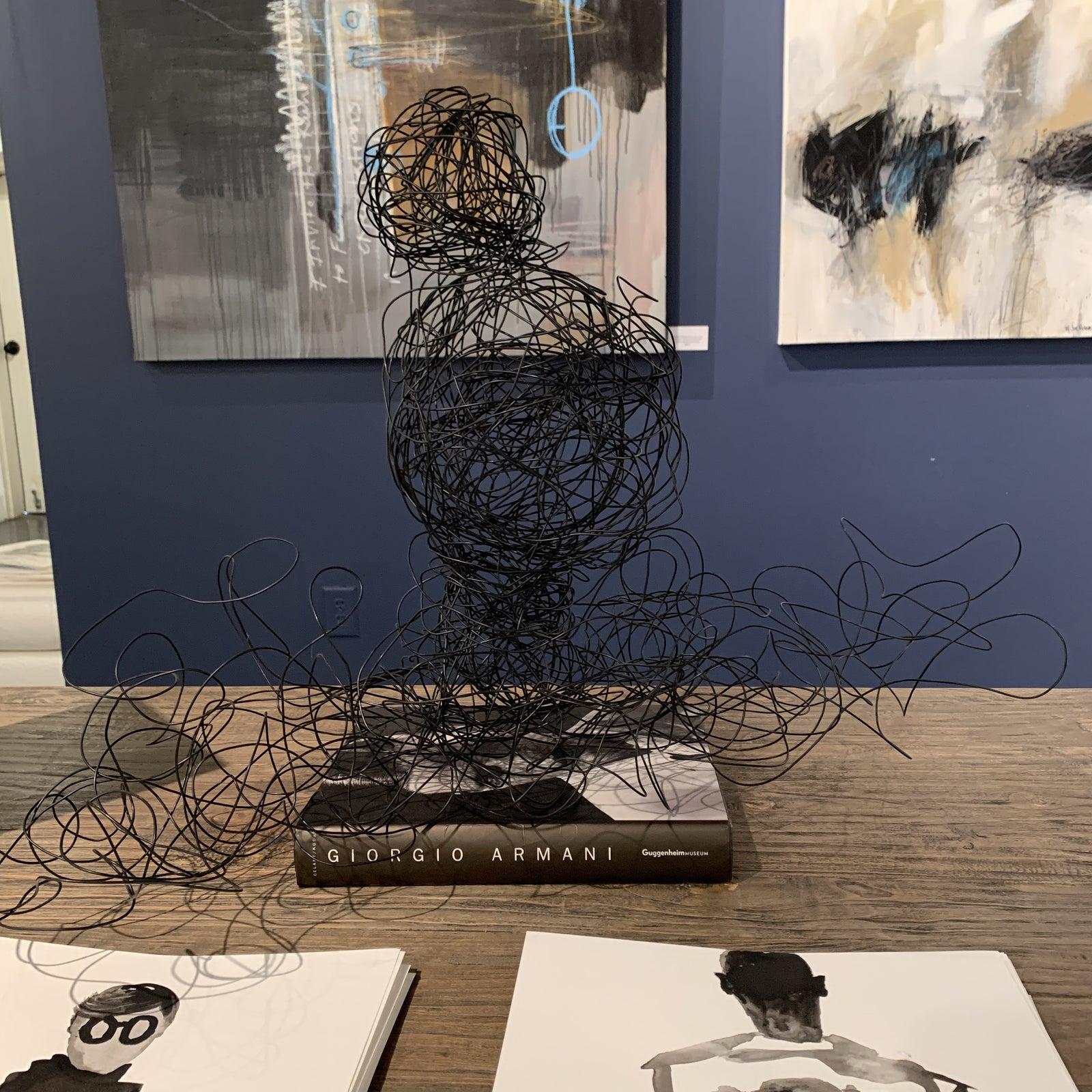 Black Wire sculpture of female head and shouders. Atlanta based artist, Katrena Griggs

This peice is hand made in her Atlanta studio. Very easy to bend and has great form. Looks fabulous on a console table , fireplace , pedestal or other table top