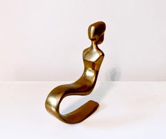 Woman in Rocking Chair, modernist table top bronze sculpture