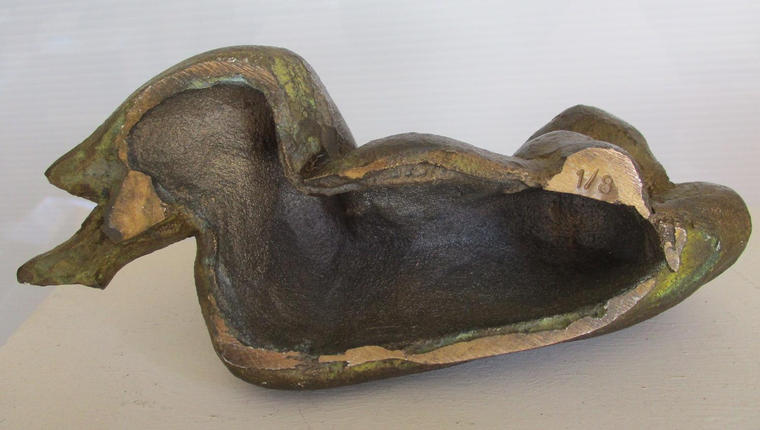 Superb modernist bronze.  Dating to the mid 20th Century, this voluptuous sleeping figure, in bronze with a fine nuanced green patina, is a monumental miniature. 
Reminiscent of the sculptures of Antoniucci Volti,  it is an original limited edition.
