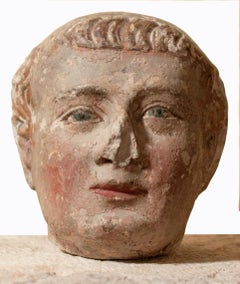 XIV th century head of a monk with polychromy