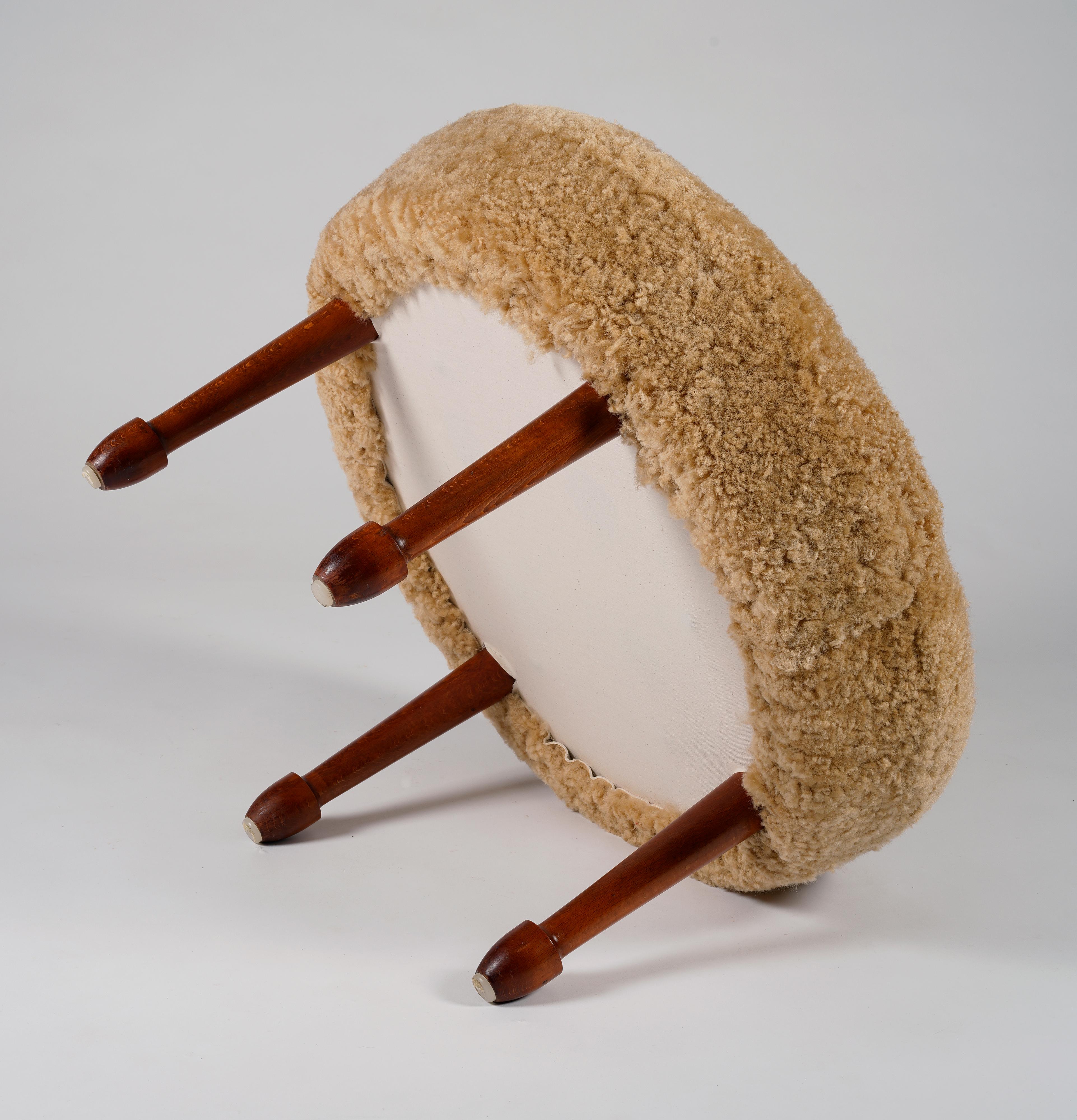 Mid-20th Century Unknown swedish designer, oversized stool reupholstered in sheepskin, 1960s For Sale
