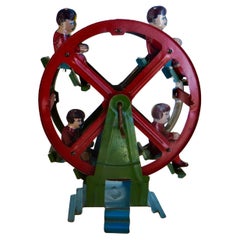 Petite roue Ferris tournée à la main par quatre Passengers, non marquée, vers 1935