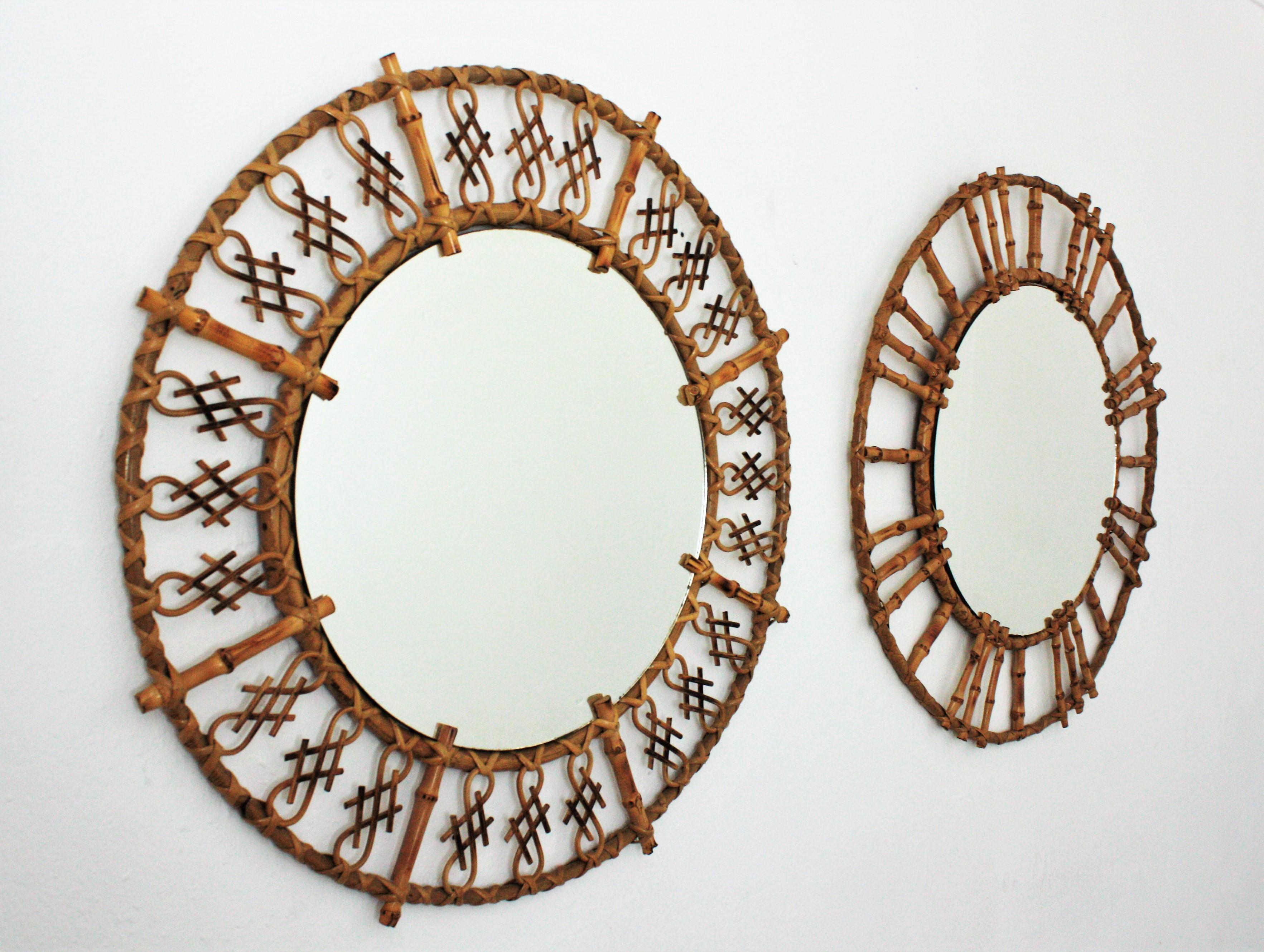 Beautiful un-matching pair of rattan and bamboo oriental inspired round mirrors. Spain and France, 1950s-1960s.
The set is comprised by two Mid-Century Modern round mirrors handcrafted with rattan and bamboo canes. One of them has a design with