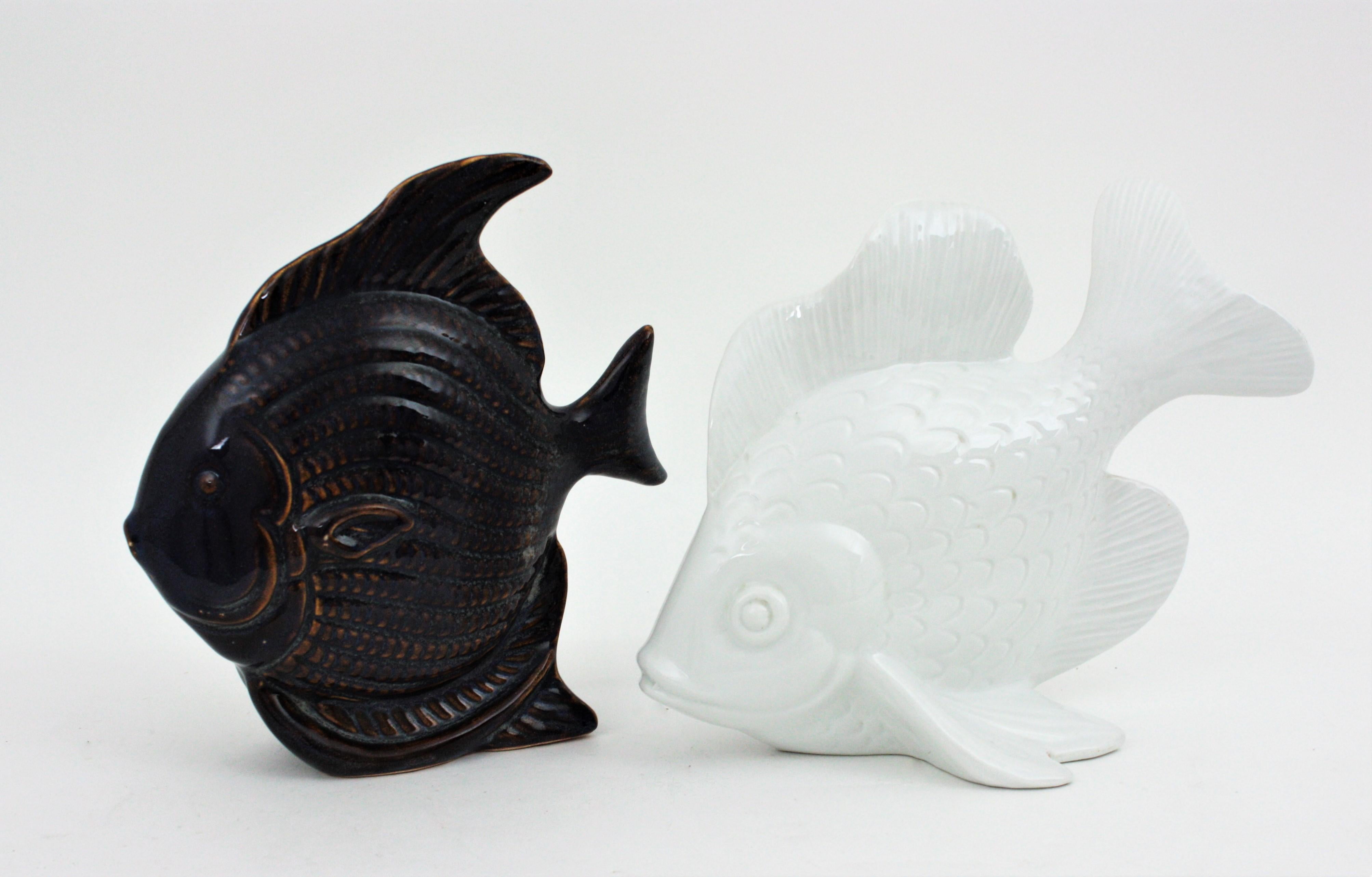 Glazed Unmatching Pair of Fish Sculptures in Cobalt Blue Ceramic and White Porcelain For Sale