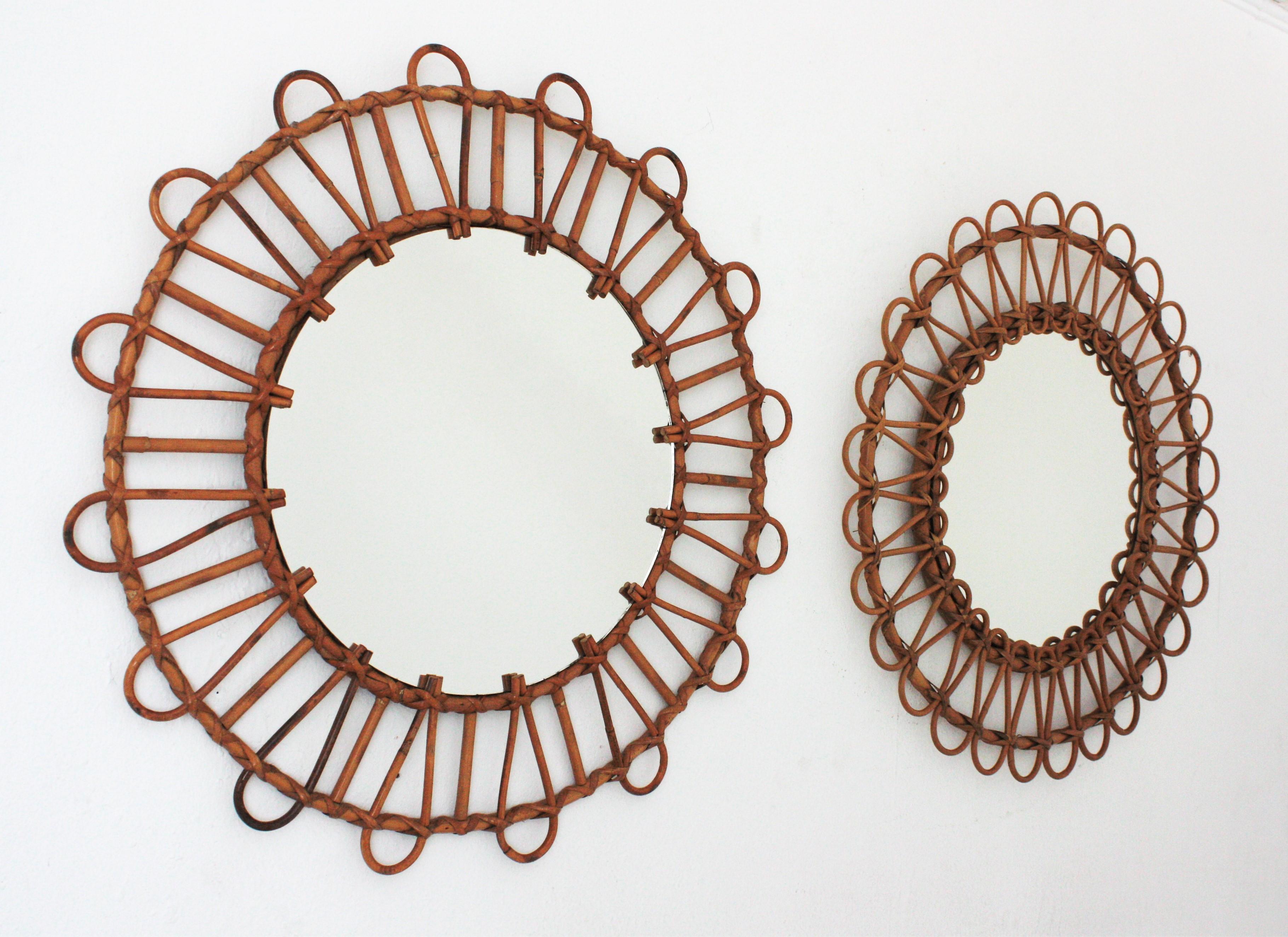 Beautiful unmatching pair of round rattan wall mirrors. Spain, 1960s
The set is comprised by two Mid-Century Modern round mirrors handcrafted with rattan and bamboo canes. Each one has a different design but similar size
Interesting to be used