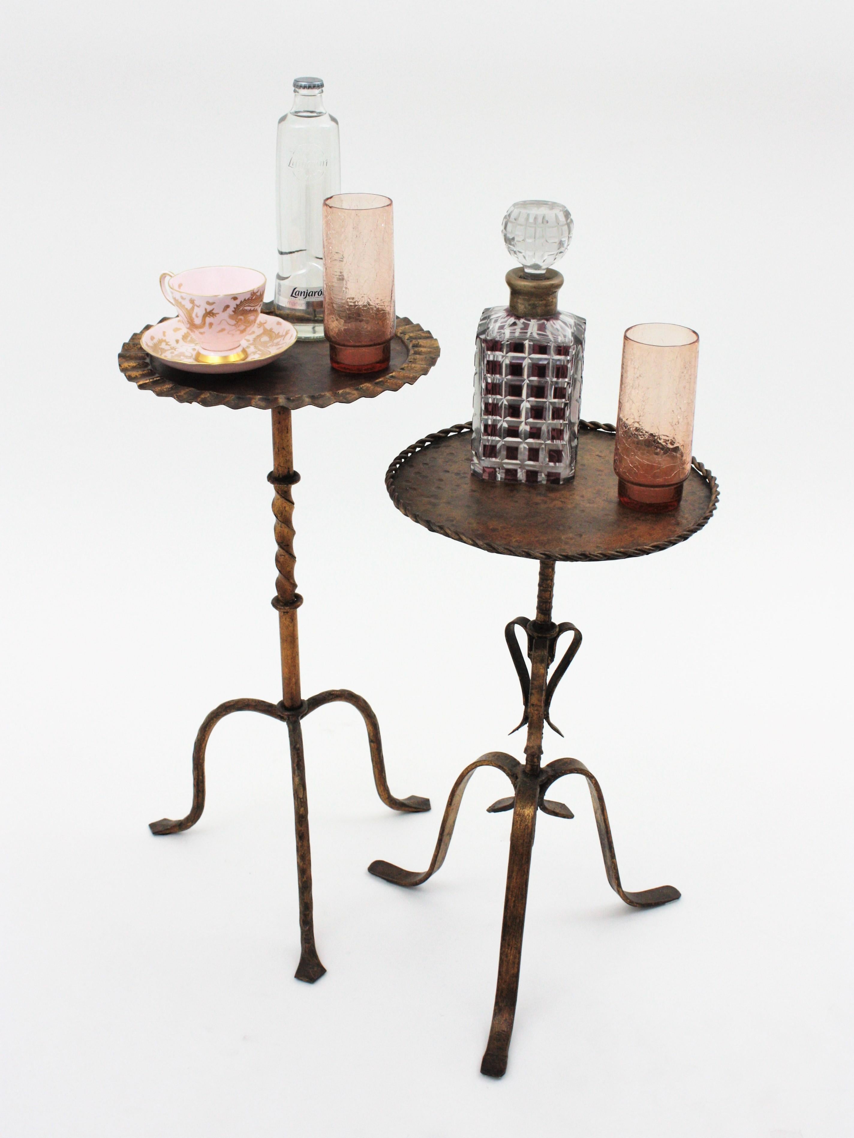 Gothic style hand forged gilt iron Guéridon or pedestal tables standing on tripod bases, Spain, 1930s-1940s.
These Martini table stand up on three-footed bases. Both handcrafted in iron, finished in gold leaf and patinated. They have a terrific