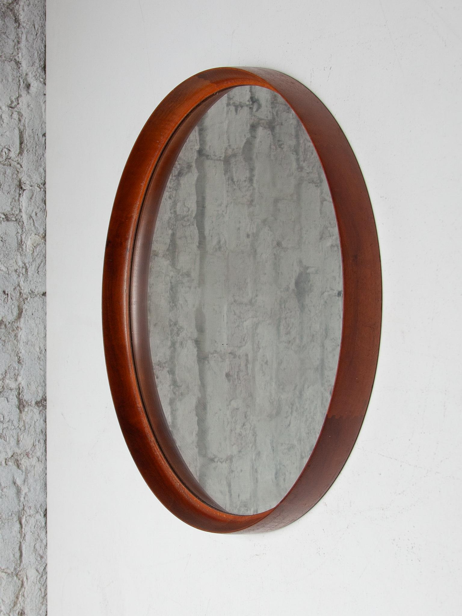 Vintage teak mirror, designed by Swedish designers Uno and Osten Kristiansson for Luxus at Vittsjö, Sweden in the 1960s, It's an exquisite and superb piece for entrance way to bathroom use.  Made in a gorgeous solid teak frame, this highly