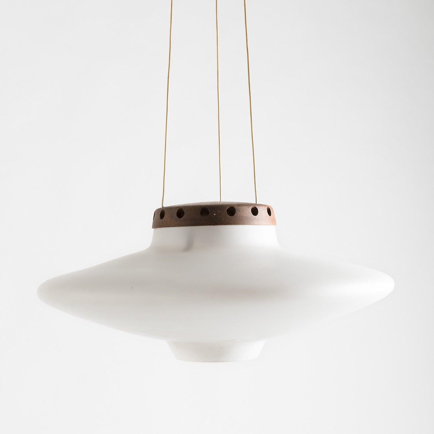 Teak wood and white opaline glass pendant, manufactured by Luxus in Sweden in late 1950s. Original wiring, overall very good condition.