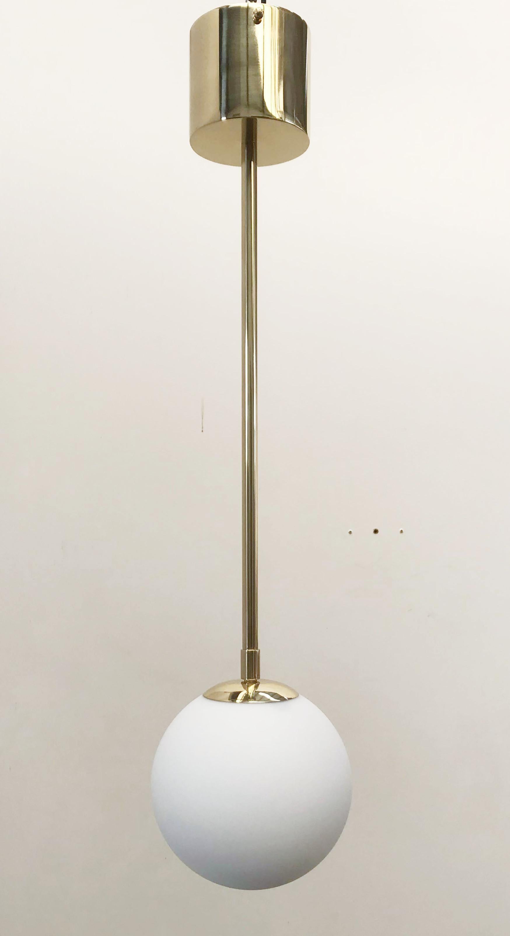 Italian pendant with Murano glass globe mounted on brass frame / Made in Italy 
Designed by Fabio Ltd, inspired by Angelo Lelli and Arredoluce styles 
1 light / E12 or E14 type / max 40W each 
Height: 29.5 inches / Diameter: 8 inches 
Order Only /