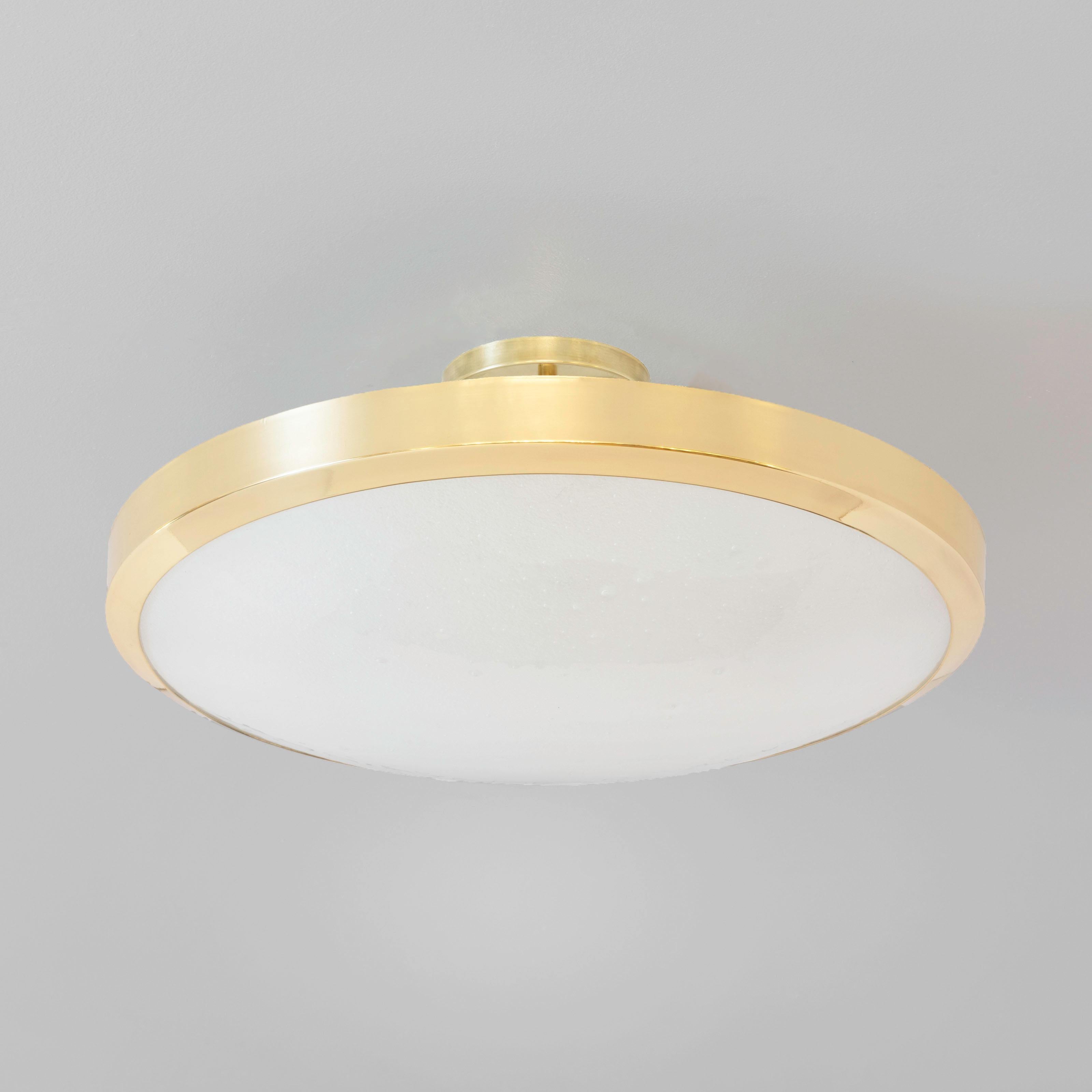The Uno Grande ceiling light is the largest member of Uno family.  It exemplifies simple elegance via its clean profile designed around a single Murano glass shade. Shown in polished brass with our signature Murano bubble glass.  See the Uno