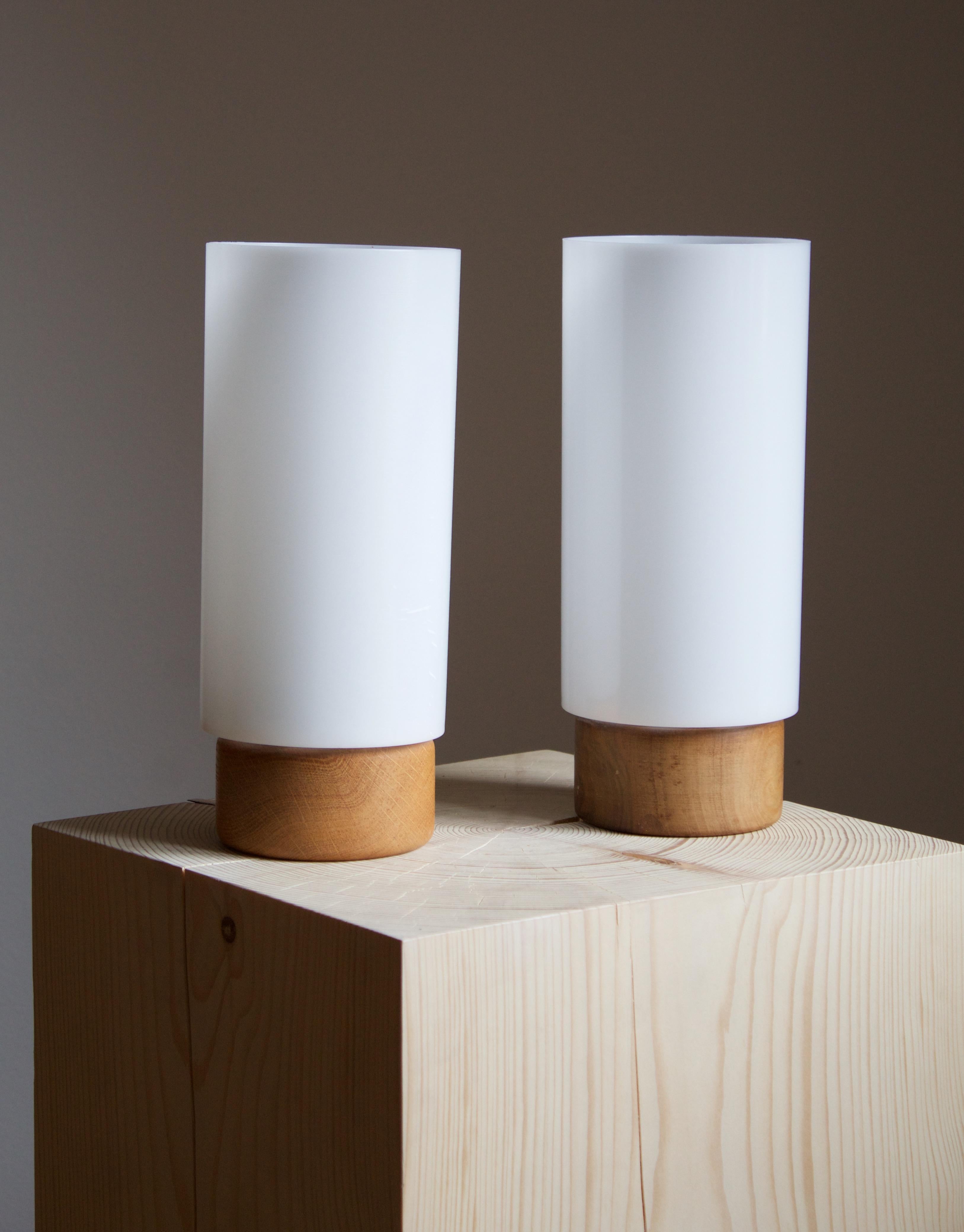 A pair of pine / acrylic table lamps. Designed by Uno Kristiansson, for Luxus, Sweden, 1960s.

Other designers of the period include Axel Einar Hjorth, Roland Wilhelmsson, Charlotte Perriand, Pierre Chapo, and Yasha Heifetz.