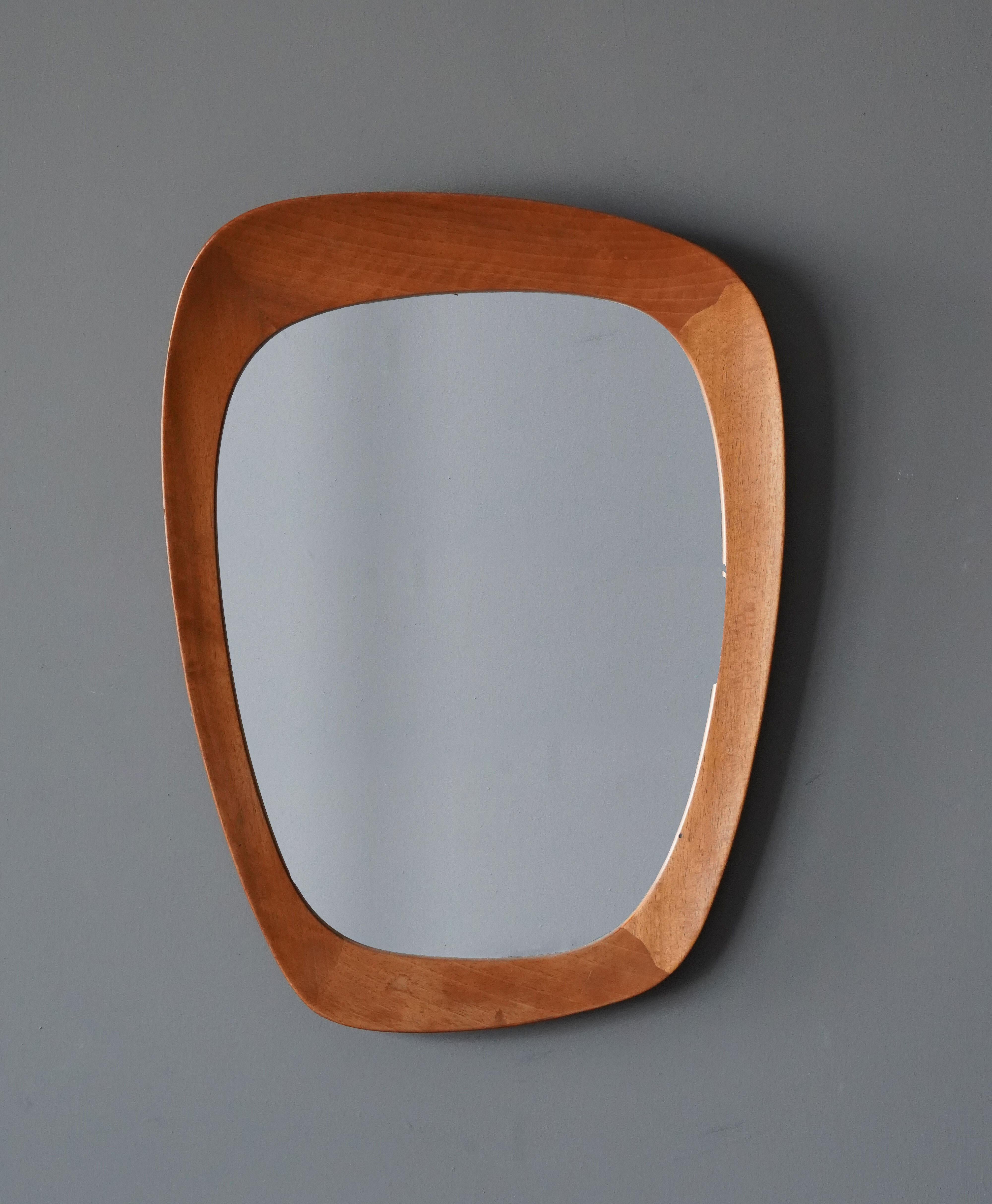 A sculptural asymmetric and organic wall mirror. Designed by Uno Kristiansson, for Vittsjö Möbel, Sweden, 1960s.

Other designers of the period include Axel Einar Hjorth, Roland Wilhelmsson, Josef Frank, Hans-Agne Jacobsen, Fontana Arte.