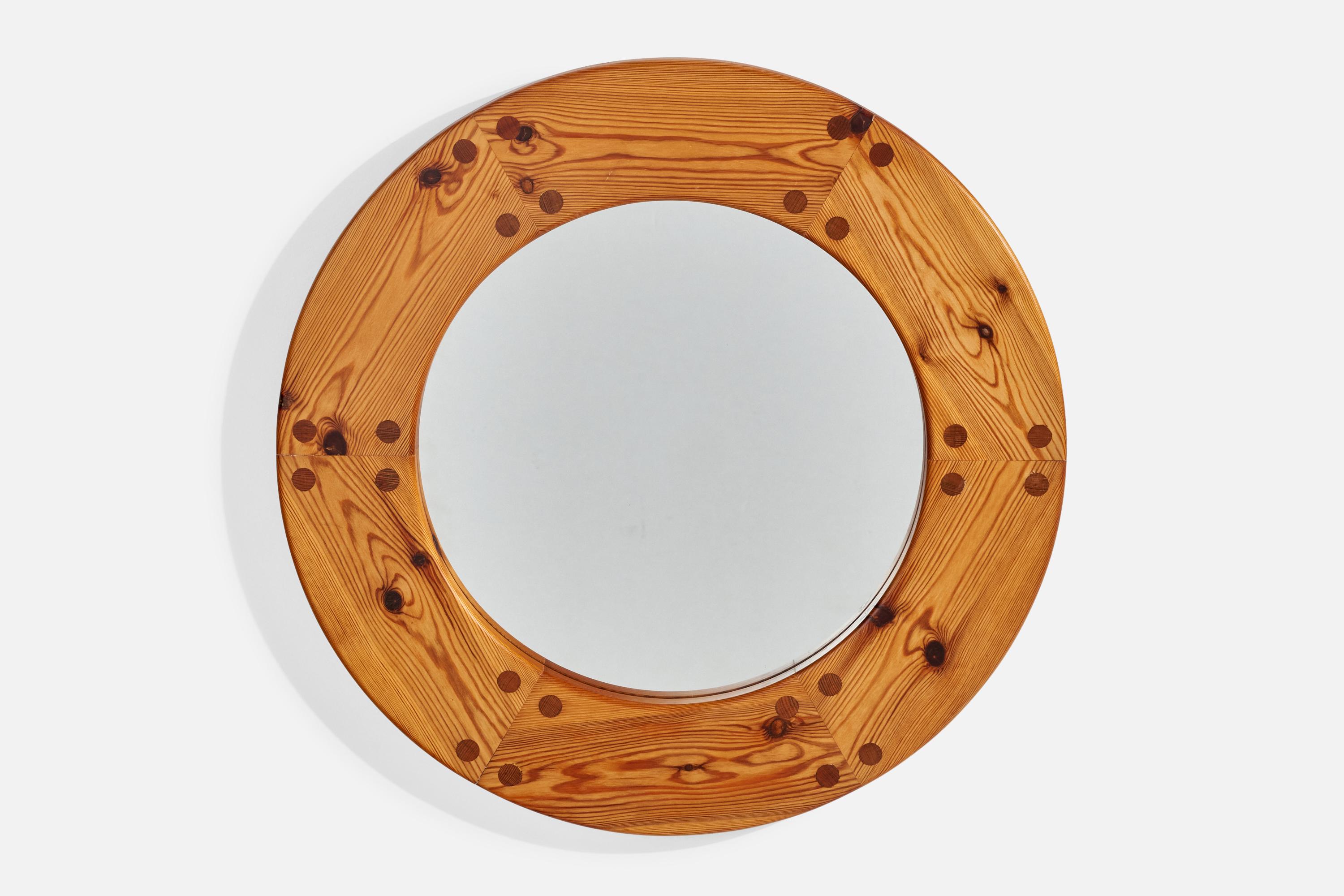 A solid pine wall mirror designed by Uno Kristiansson and produced by Luxus, Sweden, 1960s. 