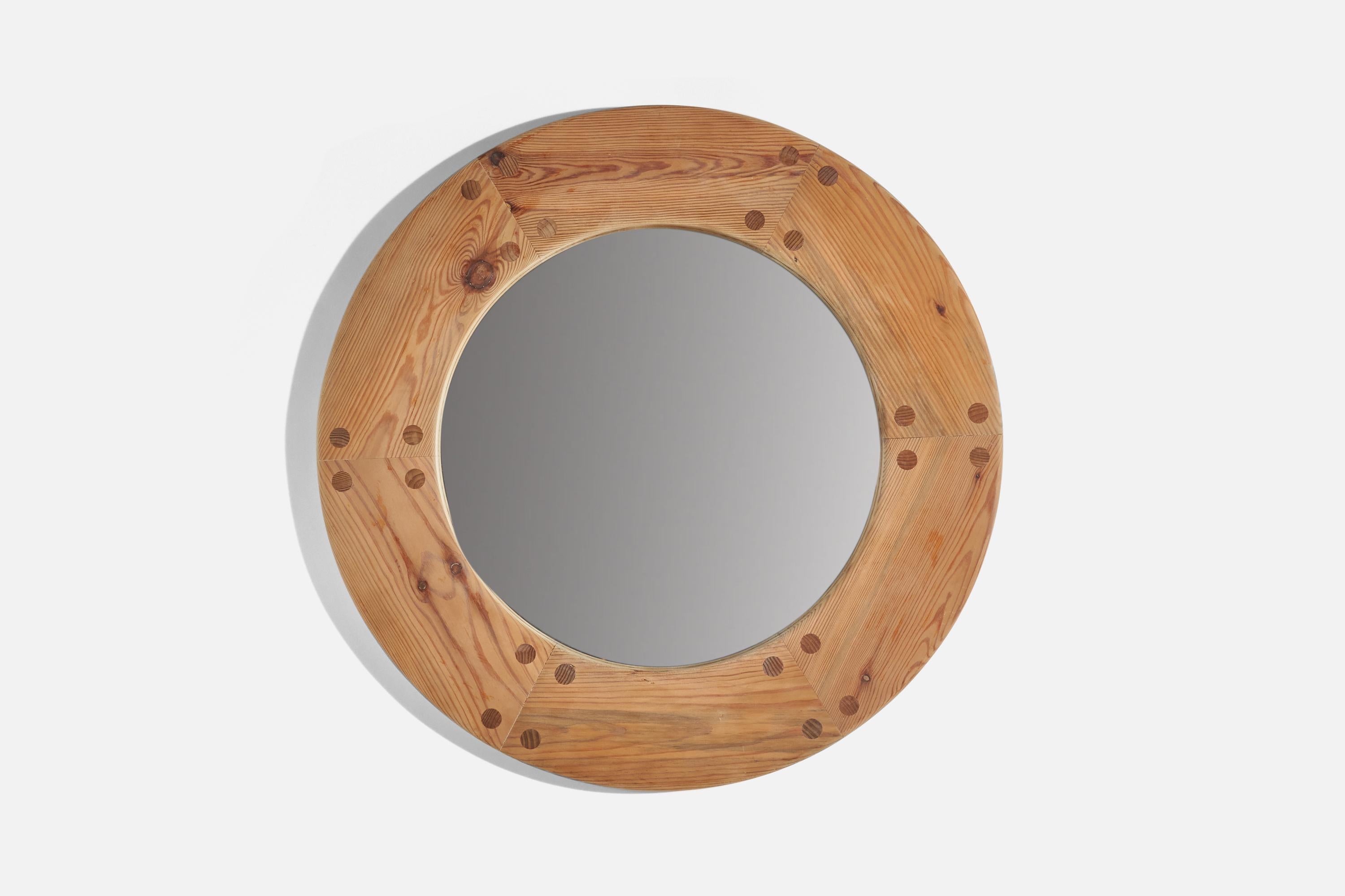 A solid pine wall mirror designed by Uno Kristiansson and produced by Luxus, Sweden, 1960s.