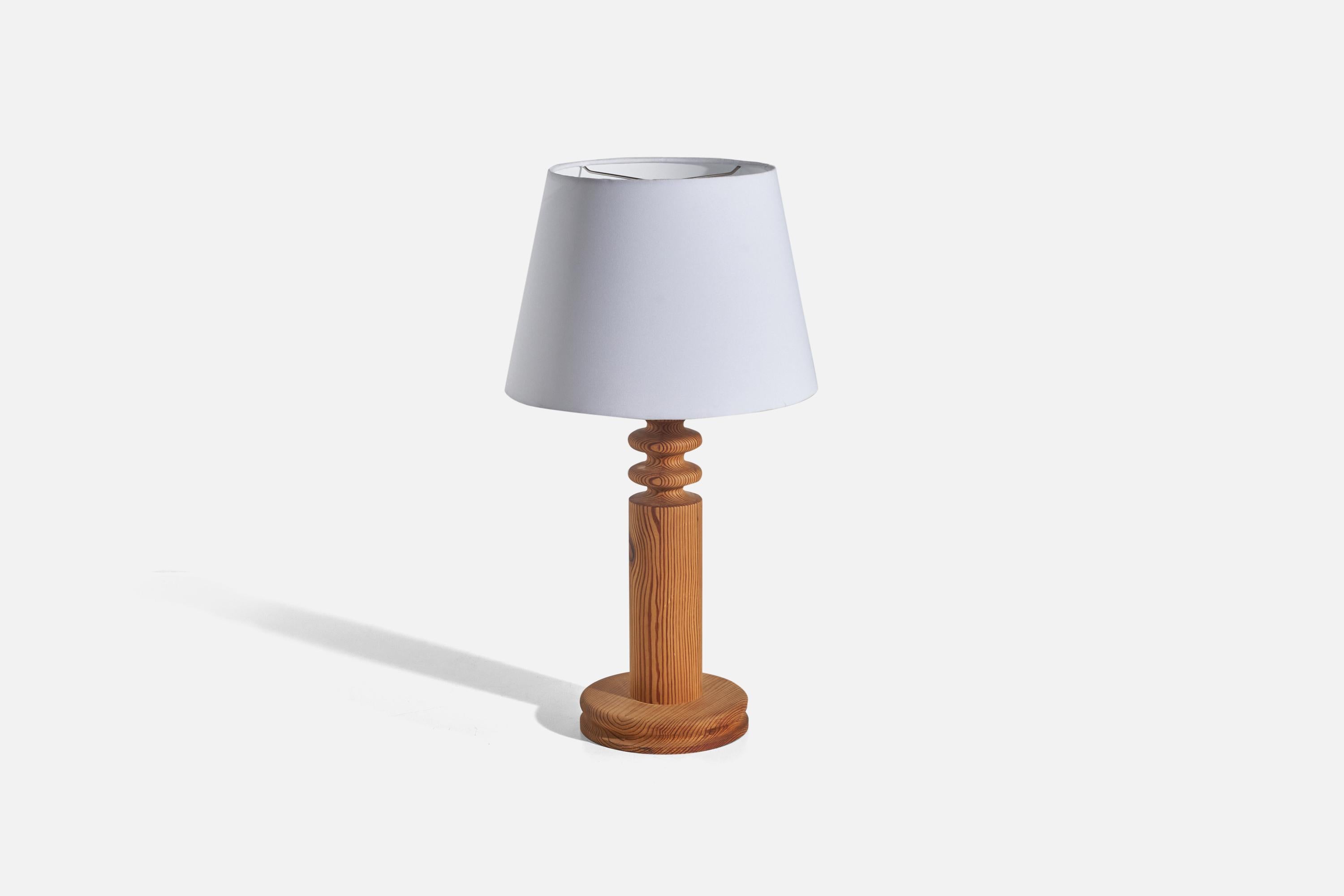 A solid pine table lamp designed by Uno Kristiansson and produced by Luxus, Sweden, 1960s.

Sold without lampshade(s)
Dimensions of lamp (inches) : 19.5 x 7.81 x 7.81 (Height x Width x Depth)
Dimensions of shade (inches) : 10.12 x 14 x 10.25