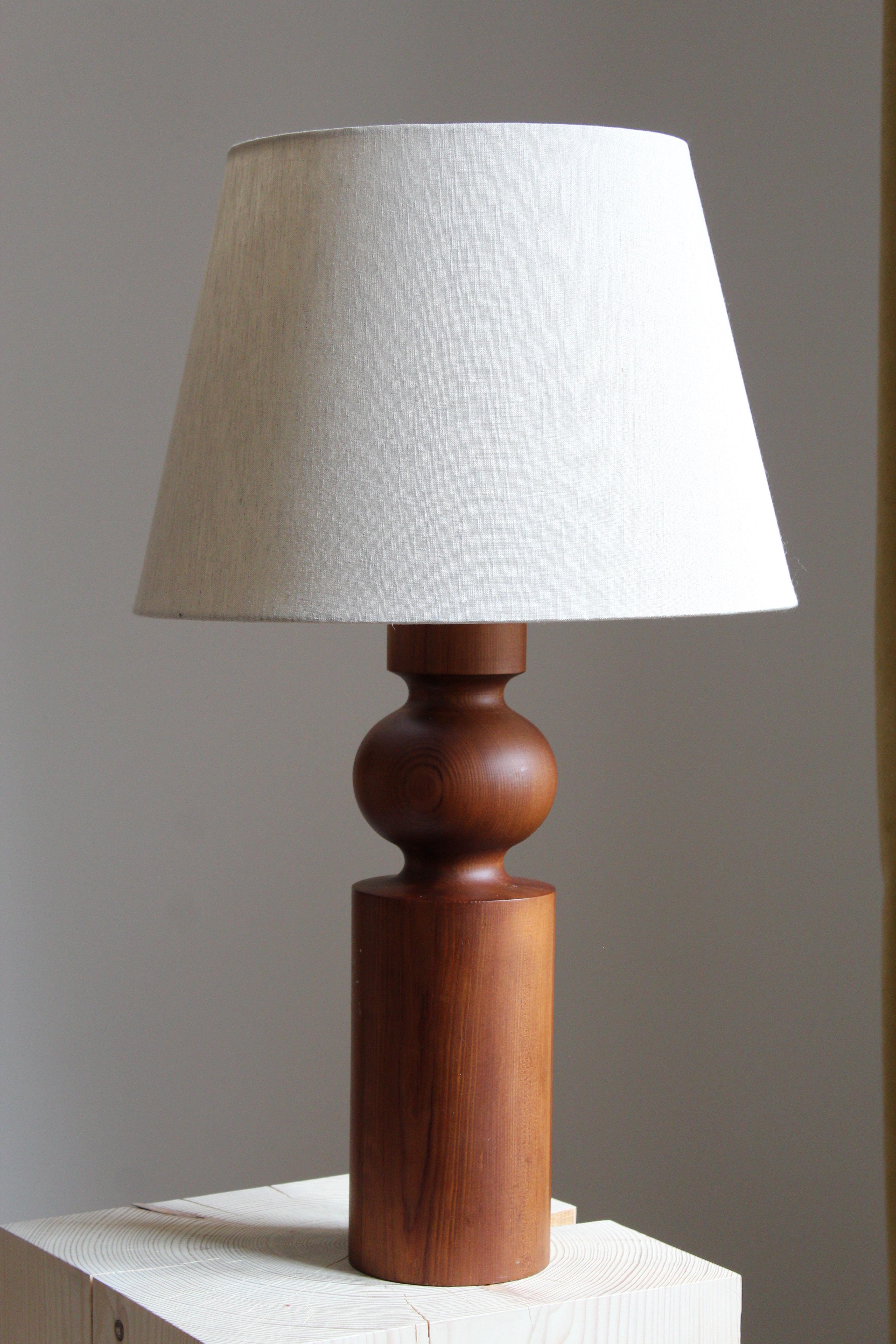 A solid pine table lamp. Designed by Uno Kristiansson, for Luxus, Sweden, 1960s.

Sold without lampshade, measurements stated are excluding lampshade.

Other designers of the period include Axel Einar Hjorth, Roland Wilhelmsson, Charlotte