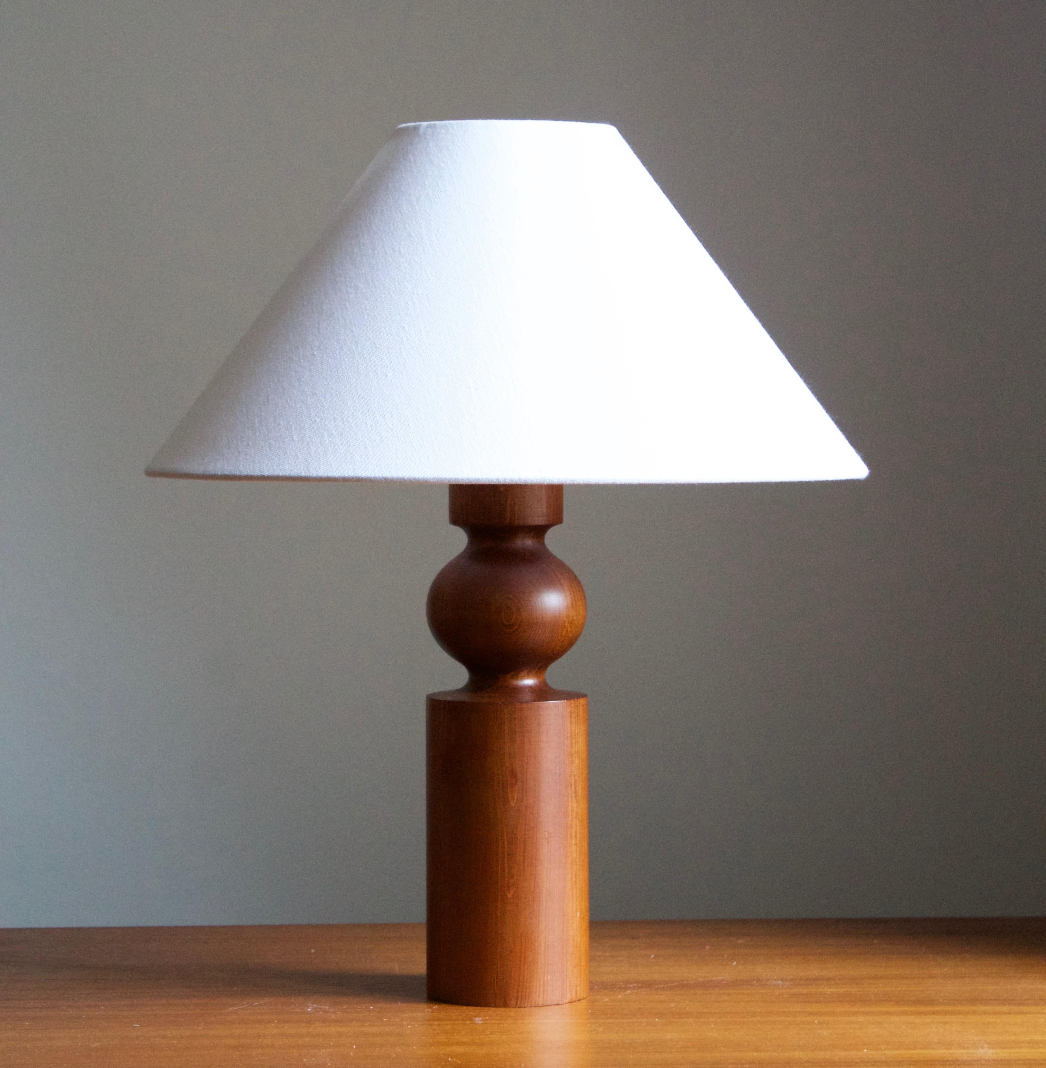 A solid pine table lamp. Designed by Uno Kristiansson, for Luxus, Sweden, 1960s.

Stated dimensions exclude lampshade, height includes socket. Sold without lampshade.

Other designers of the period include Axel Einar Hjorth, Roland Wilhelmsson,