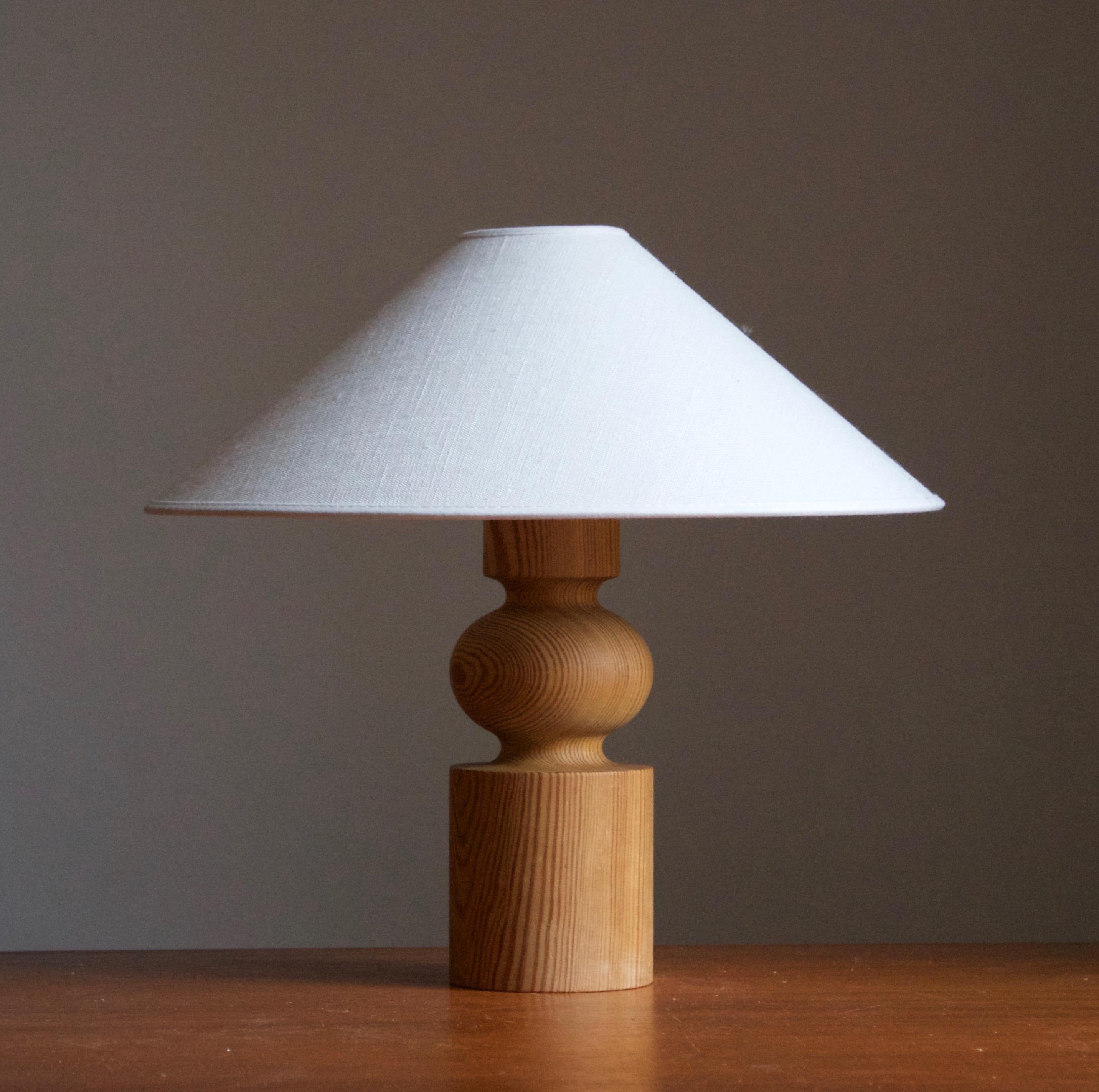 A sculptural solid pine table lamp. Designed by Uno Kristiansson, for Luxus, Sweden, 1970s. Branded.

Stated dimensions exclude lampshade, height includes socket. Sold without lampshade.

Other designers of the period include Axel Einar Hjorth,