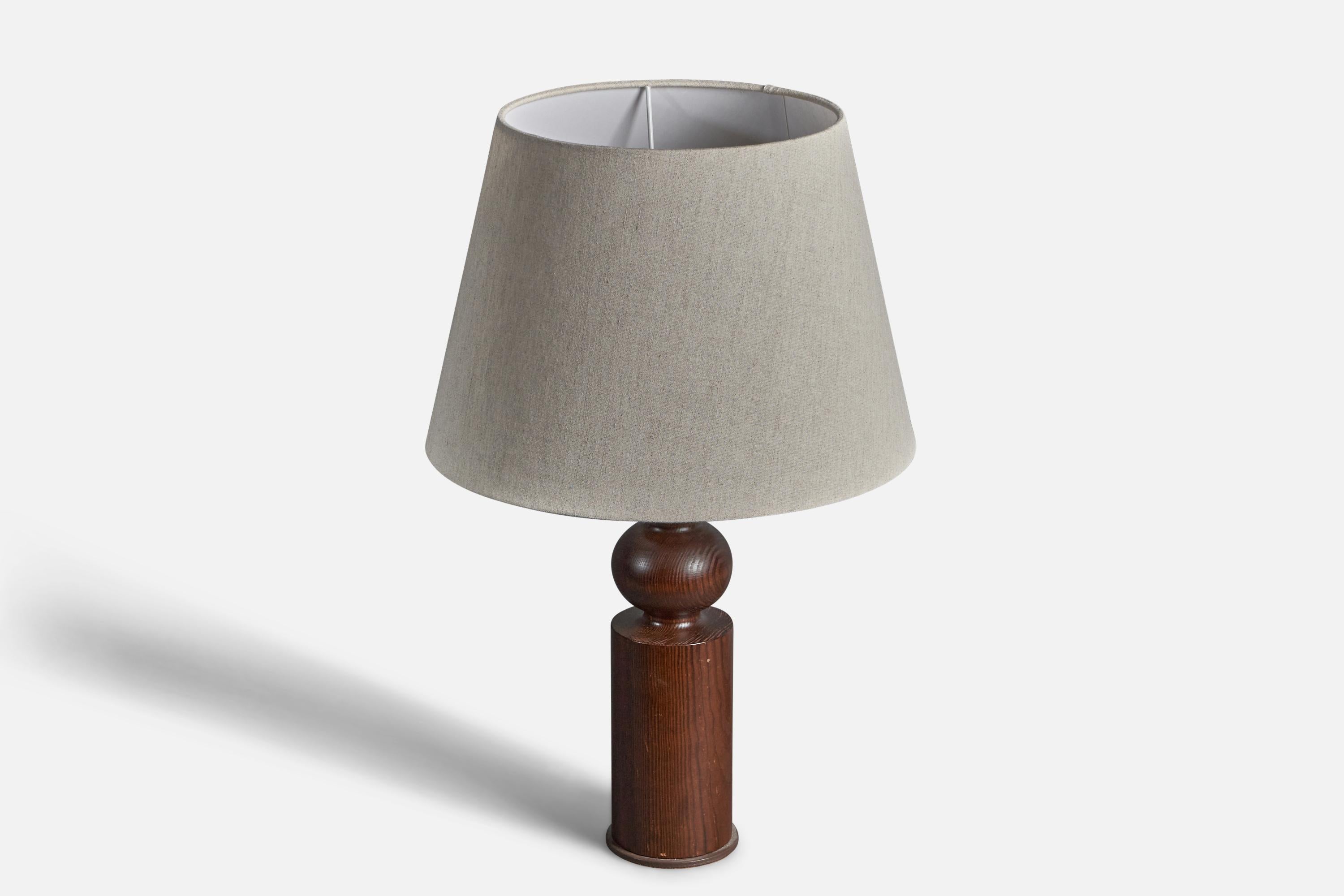 A sculptural solid pine table lamp. Designed by Uno Kristiansson, for Luxus, Sweden, 1970s. Branded and labeled. Metal foot to base.

Stated dimensions exclude lampshade, height includes socket. Sold without lampshade.

Other designers of the