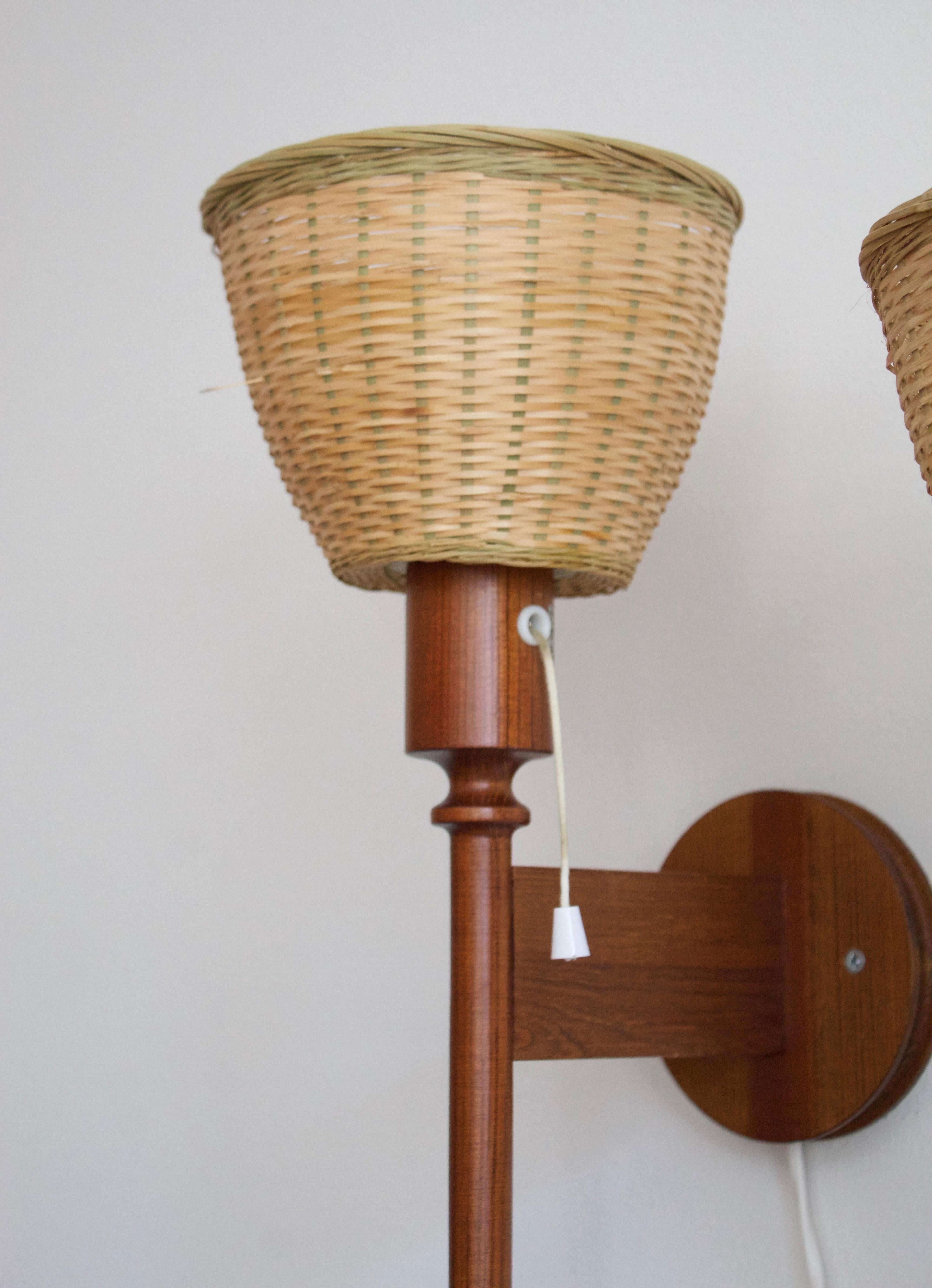 Uno Kristiansson, Wall Lights, Dark Stained Pine, Rattan, Luxus, Sweden, 1960s In Good Condition In High Point, NC