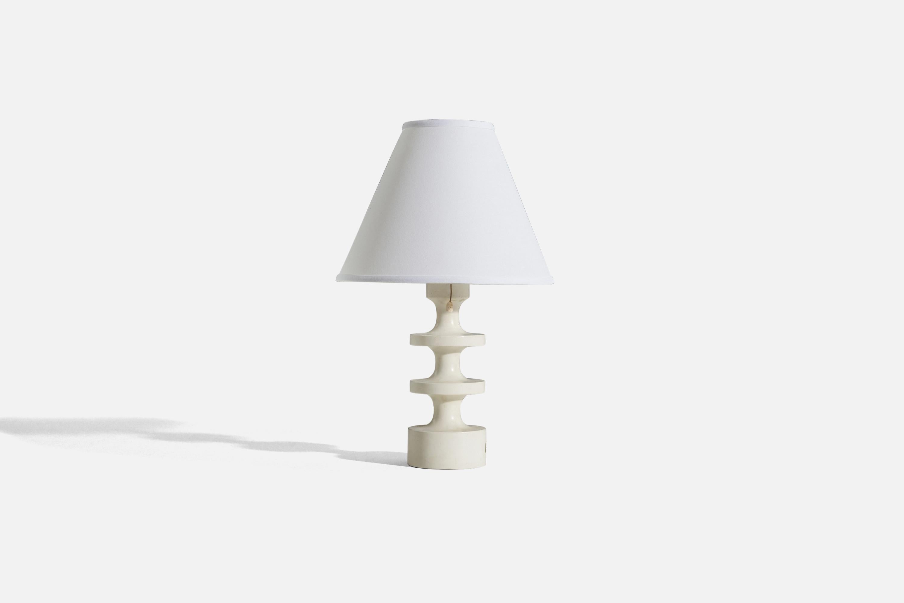 A white-painted wooden table lamp designed by Uno Kristiansson and produced by Luxus, Sweden, 1960s.

Sold without lampshade. 
Dimensions of Lamp (inches) : 11.875 x 3.625 x 3.625 (H x W x D)
Dimensions of Shade (inches) : 4 x 10 x 8 (T x B x