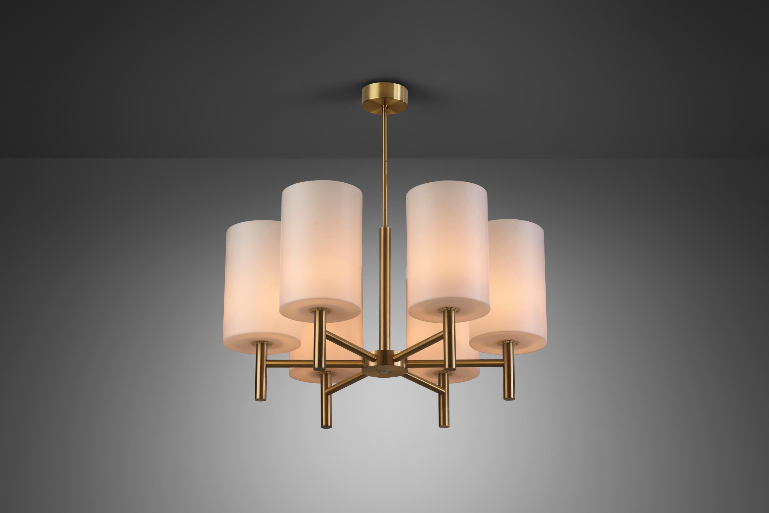 This marvellous, brass six-light ceiling light was created in what we now call “the golden age of Scandinavian design”. The period saw the revival of an elementary, undecorated visual language, emphasizing sleek design and craftsmanship as this