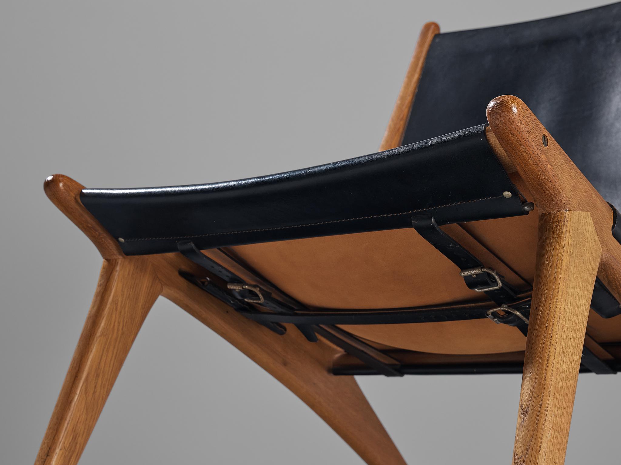 Suédois Uno & Östen Kristiansson pour Luxus Chaise de chasse en cuir et chêne en vente