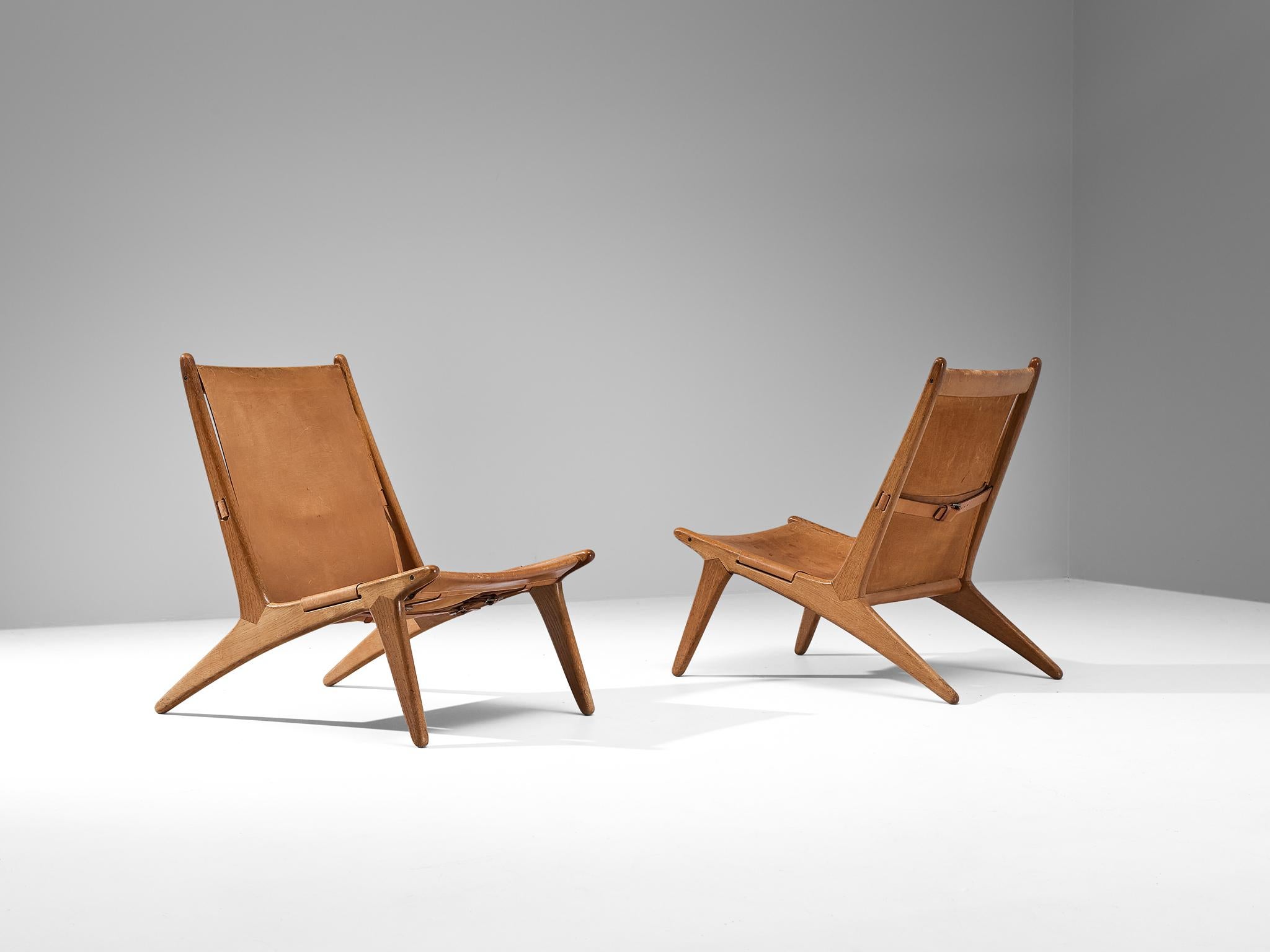 Milieu du XXe siècle Uno & Östen Kristiansson pour Luxus Chaise de chasse en cuir et chêne  en vente